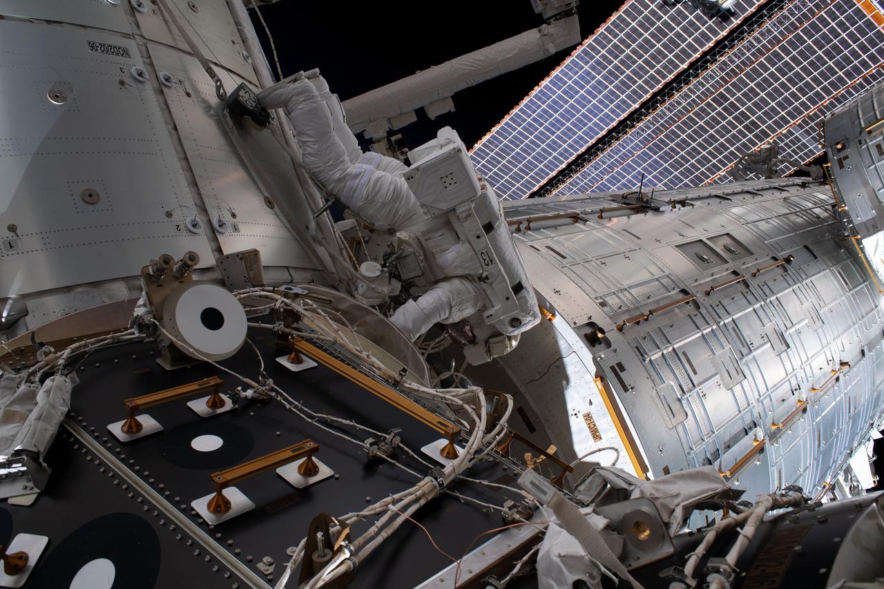 iss060e043181 (Aug. 21, 2019) --- NASA astronaut Andrew Morgan is pictured working outside the International Space Station during a six-hour and 32-minute spacewalk to install the orbiting lab’s second commercial crew vehicle docking port, the International Docking Adapter-3 (IDA-3). The IDA-3 will accommodate the future arrivals of Boeing CST-100 Starliner and SpaceX Crew Dragon commercial crew spacecraft.