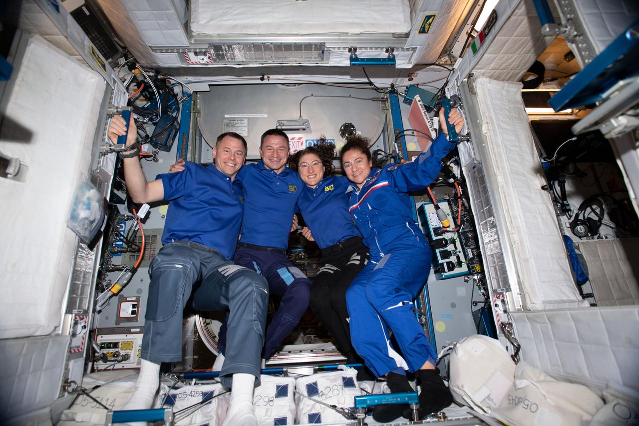 iss060e080523 (Sept. 25, 2019) --- Four NASA astronauts, all members of the Astronaut Class of 2013, pose for a portrait aboard the International Space Station. From left are Flight Engineers Nick Hague, Andrew Morgan, Christina Koch and Jessica Meir.