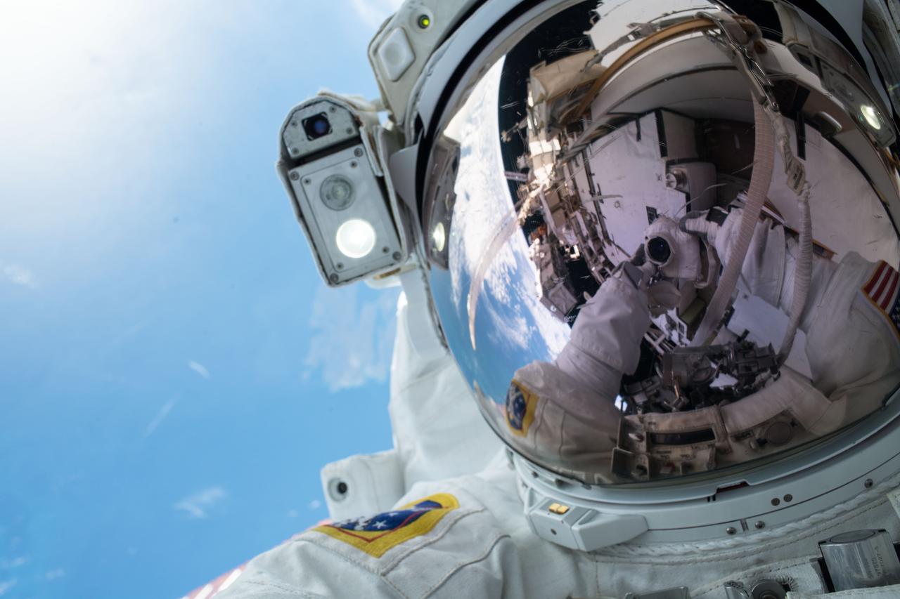 iss061e003499 (Oct. 6, 2019) --- NASA astronaut Andrew Morgan takes an out-of-this-world "space-selfie" during a spacewalk to upgrade International Space Station power systems on the Port- 6 (P6) truss structure. He and fellow NASA astronaut Christina Koch (out of frame) worked outside in the vacuum of space for seven hours and one minute to begin the latest round of upgrading the station's large nickel-hydrogen batteries with newer, more powerful lithium-ion batteries.