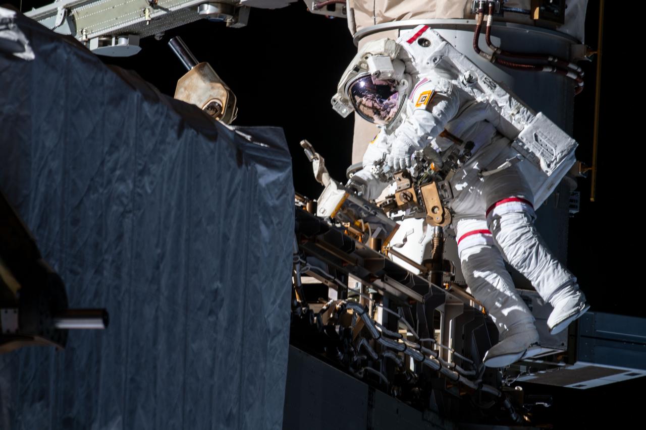 iss061e005428 (Oct. 11, 2019) --- NASA astronaut Andrew Morgan works while tethered on the Port 6 truss segment of the International Space Station to replace older hydrogen-nickel batteries with newer, more powerful lithium-ion batteries. Fellow NASA astronaut Christina Koch (out of frame) assisted Morgan during the six-hour and 45-minute spacewalk.