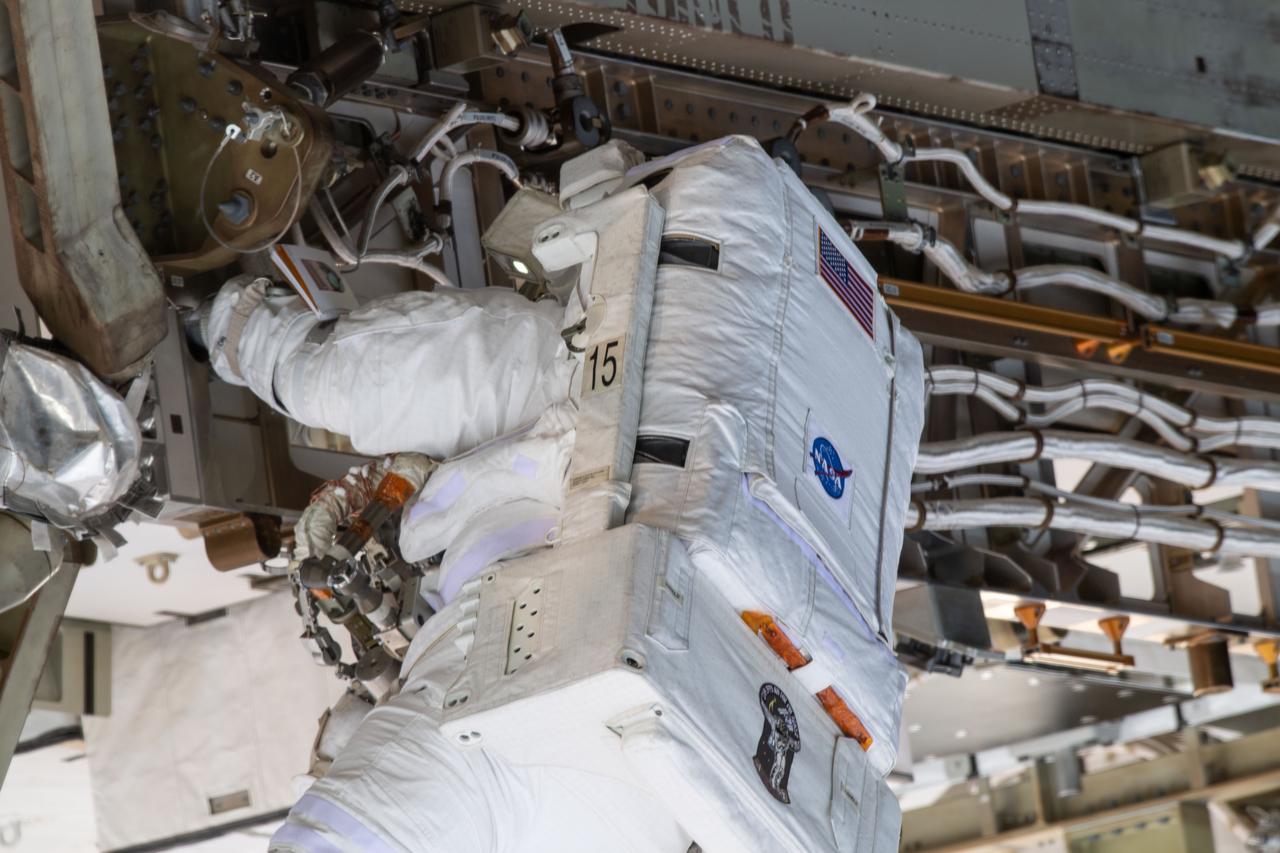 iss061e008788 (Oct. 18, 2019) --- NASA astronaut Jessica Meir conducts her first spacewalk at the International Space Station. She and fellow NASA astronaut Christina Koch (out of frame) ventured into the vacuum of space for seven hours and 17 minutes to swap a failed battery charge-discharge unit (BCDU) with a spare during the first all-woman spacewalk. The BCDU regulates the charge to the batteries that collect and distribute solar power to the orbiting lab’s systems.
