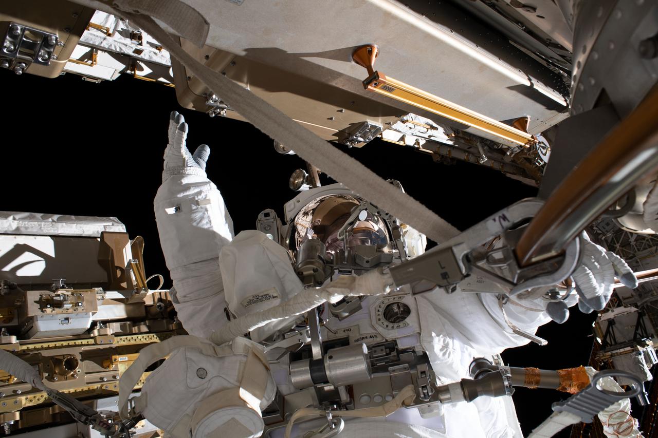 iss061e011802 (Oct. 18, 2019) --- NASA astronaut Jessica Meir is pictured during a spacewalk with fellow NASA astronaut Christina Koch (out of frame). They ventured into the vacuum of space for seven hours and 17 minutes to swap a failed battery charge-discharge unit (BCDU) with a spare during the first all-woman spacewalk. The BCDU regulates the charge to the batteries that collect and distribute solar power to the orbiting lab’s systems.