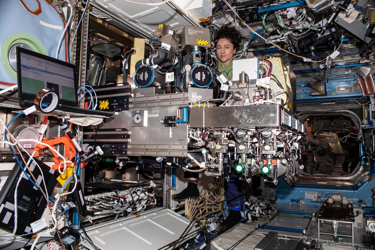 iss061e013314 (Oct. 24, 2019) --- NASA astronaut Jessica Meir of Expedition 61 works on components of the Combustion Integrated Rack aboard the International Space Station's U.S. Destiny laboratory module.
