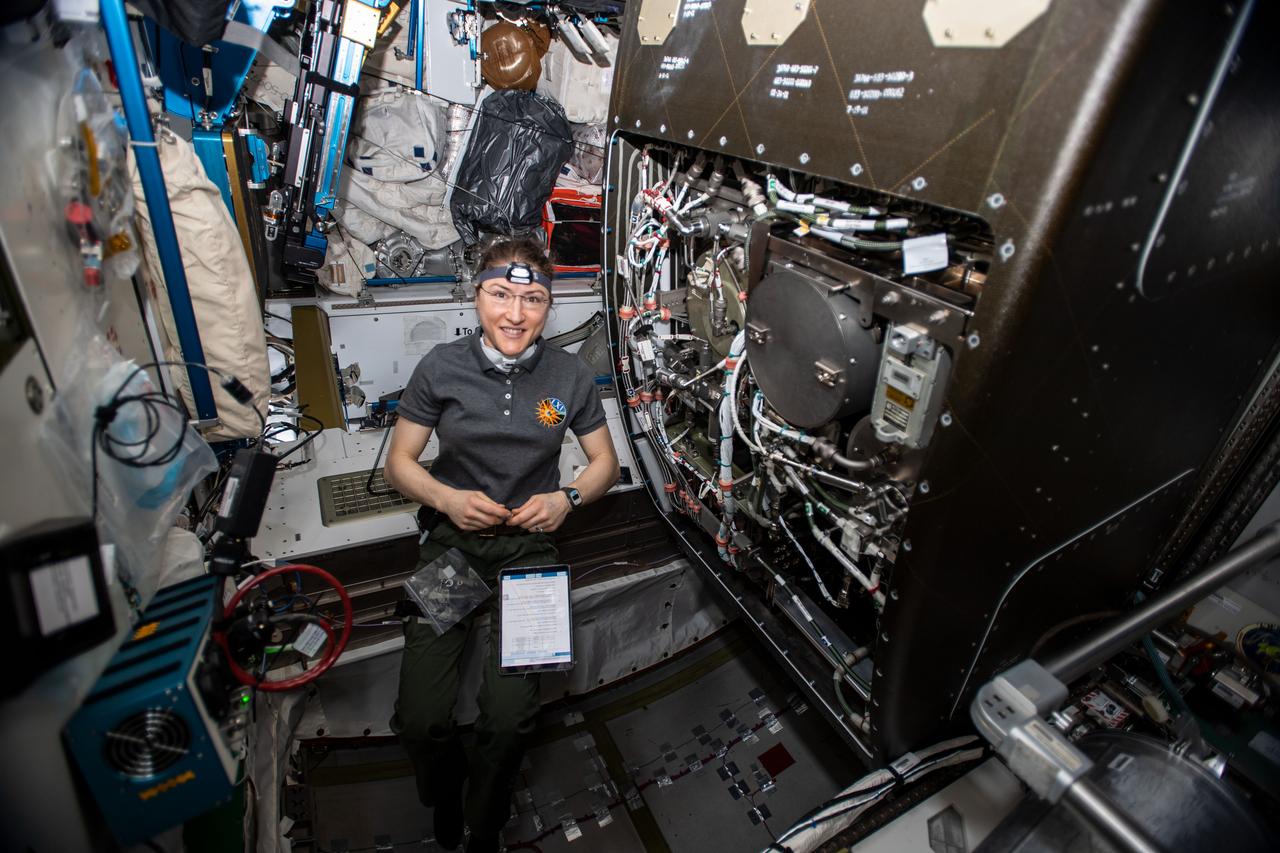 iss061e020169 (Oct. 29, 2019) --- NASA astronaut Christina Koch works on orbital plumbing tasks as she replaces components inside the International Space Station's bathroom, the Waste and Hygiene Compartment, located in the Tranquility module.