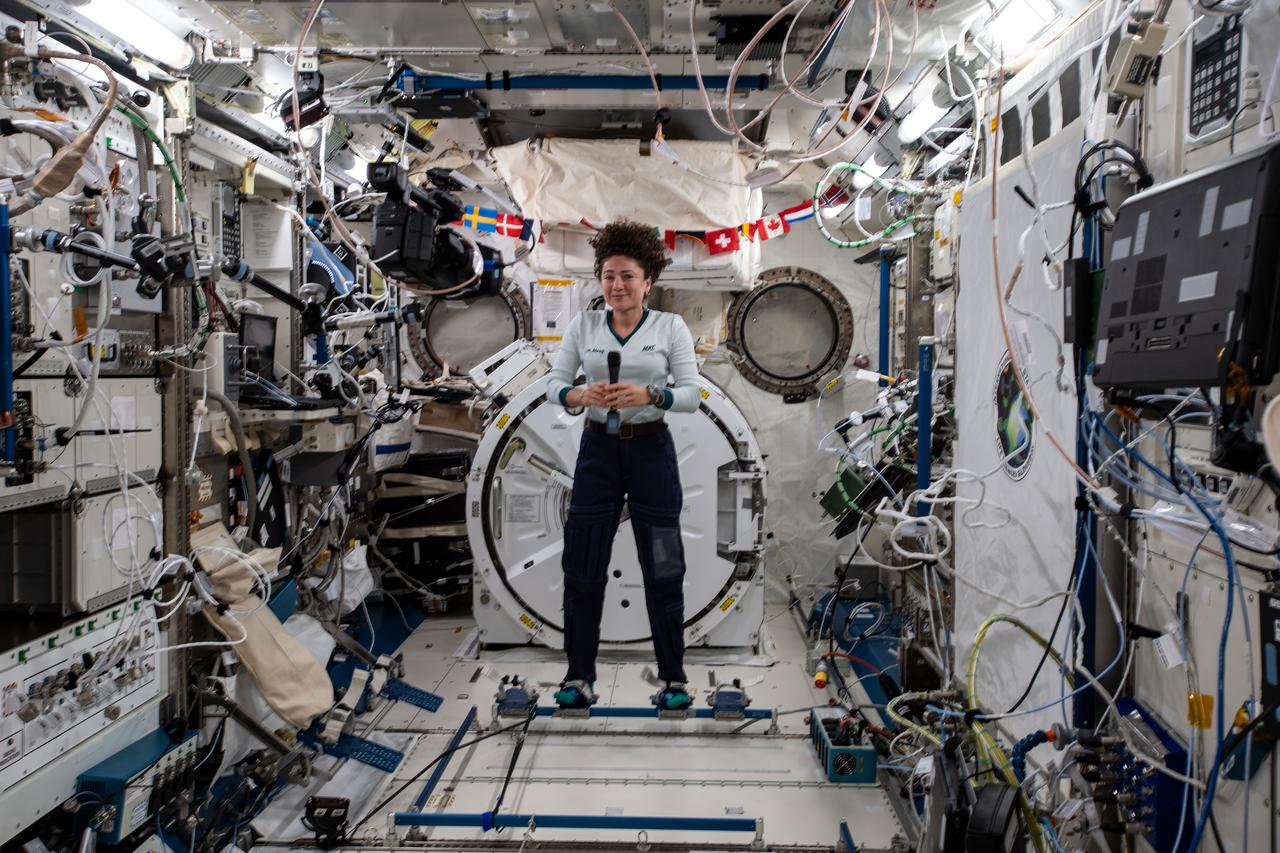 iss061e026260 (Nov. 1, 2019) --- NASA astronaut Jessica Meir, attached to foot restraints inside the Kibo laboratory module from JAXA (Japan Aerospace Exploration Agency), participates in interviews with journalists from Bangor, Maine and Boston, Massachusetts.