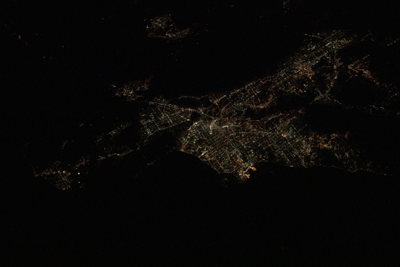 iss061e028440 (Nov. 4, 2019) --- Los Angeles, California is pictured at night as the International Space Station was orbiting 257 miles above the Pacific Ocean and about 215 miles southwest of the L.A. coastline. The bright orange lights at the center are Terminal Island and the Port of Los Angeles.