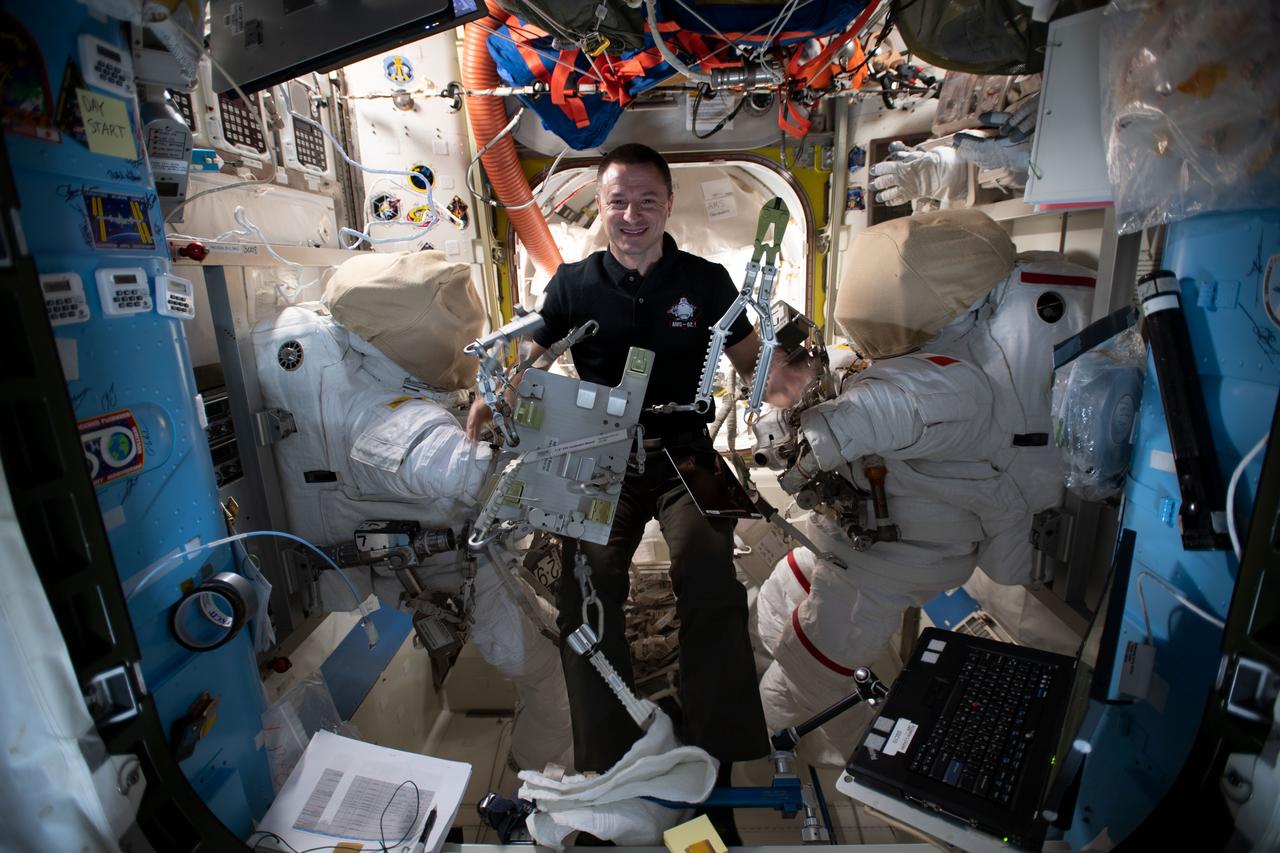 iss061e034867 (Nov. 12, 2019) --- NASA astronaut Andrew Morgan checks specialized spacewalking tools designed specifically to repair the International Space Station's cosmic particle detector, the Alpha Magnetic Spectrometer (AMS). Morgan and ESA (European Space Agency) astronaut Luca Parmitano will conduct several spacewalks in November to upgrade the AMS thermal control system.