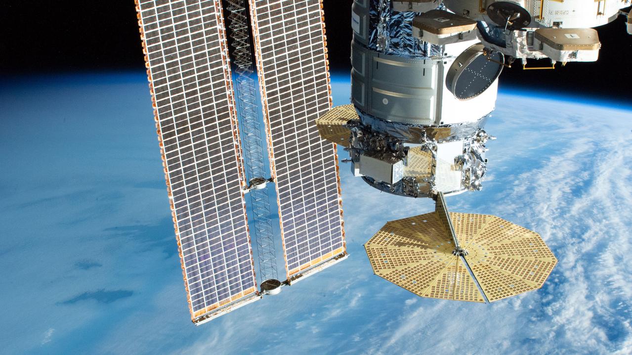 iss061e036670 (Nov. 19, 2019) --- Northrop Grumman's Cygnus space freighter with its prominent cymbal-shaped solar arrays is pictured as the International Space Station orbited 265 miles above the South Atlantic Ocean near the tip of South Africa. In the top right foreground, is the seven-windowed cupola with its window shutters open. Behind Cygnus, is the one of the station's basketball court-sized solar arrays.