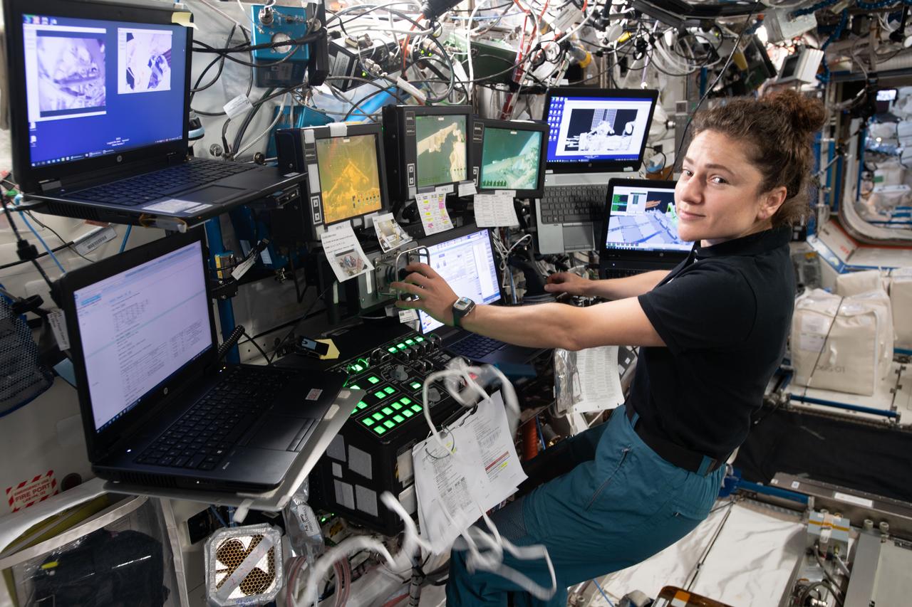 iss061e045447 (Nov. 15, 2019) --- NASA astronaut Jessica Meir is at the robotics workstation controlling the Canadarm2 robotic arm to support the first spacewalk to repair the Alpha Magnetic Spectrometer (AMS), the International Space Station's cosmic particle detector. Astronauts Luca Parmitano of ESA (European Space Agency) and Andrew Morgan of NASA worked six hours and 39 minutes in the vacuum of space during the first of at least four planned AMS repair spacewalks.