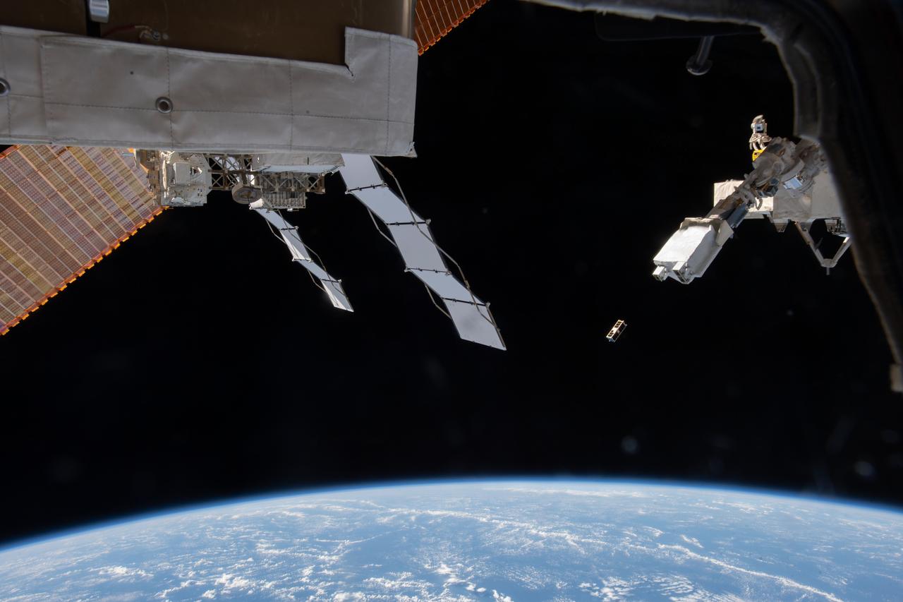 iss061e051961 (11/20/2019) --- An external view of the deployment of the AQT-D CubeSat from the JEM Small Satellite Orbital Deployer aboard the International Space Station (ISS). AQua Thruster-Demonstrator (AQT-D) is a 3U CubeSat demonstration of a water resistojet propulsion system developed by The University of Tokyo.