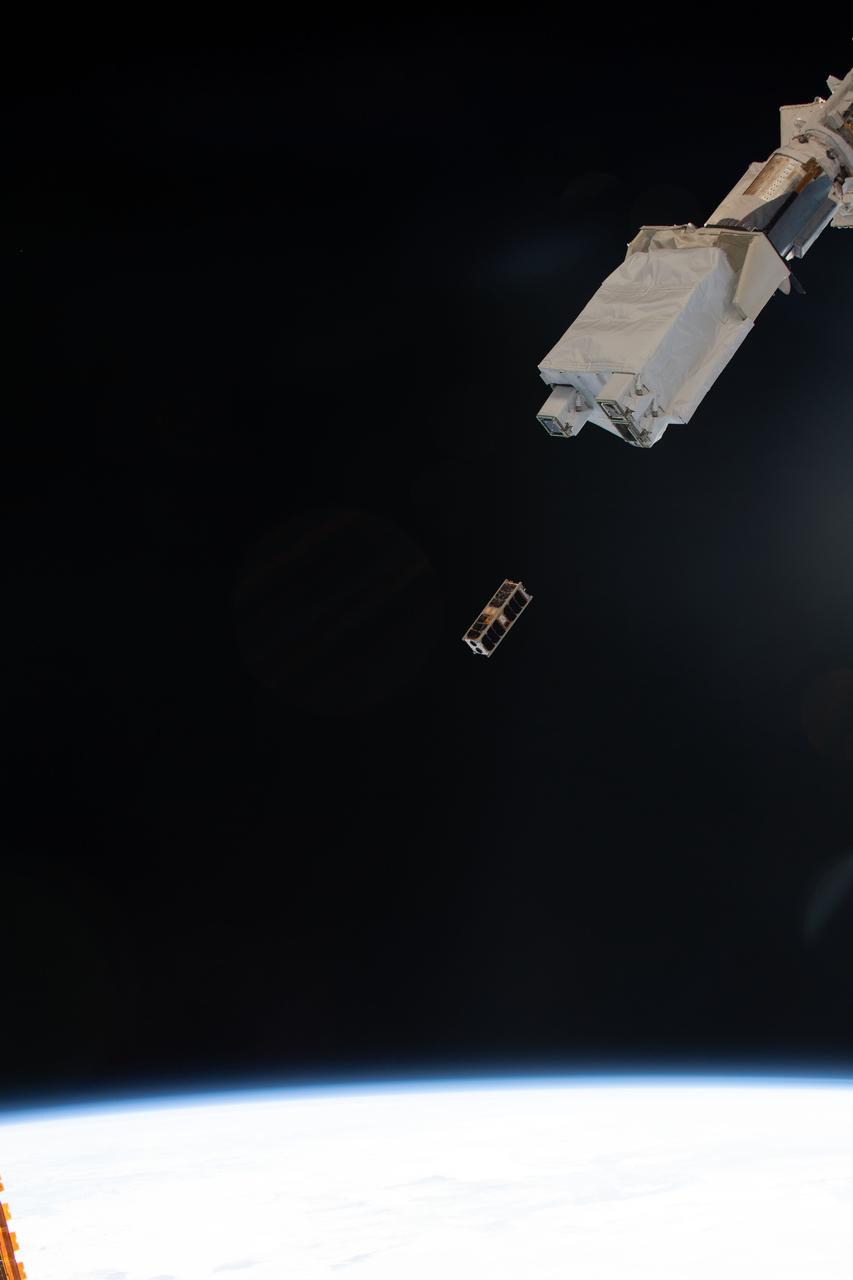 iss061e052148 (11/20/2019) --- An external view of the deployment of the RWASAT-1 CubeSat from the JEM Small Satellite Orbital Deployer aboard the International Space Station (ISS). RWanda Satellite-1 (RWASAT-1) is the first Rwandan 3-Unit (3U) CubeSat is built under a partnership of the Rwanda Utilities Regulatory Authority (RURA) and Tokyo University, to help develop a space engineering capacity in Rwanda. RWASAT-1 has two cameras for monitoring the status of agriculture, and a receiver for data collection from ground based sensors.