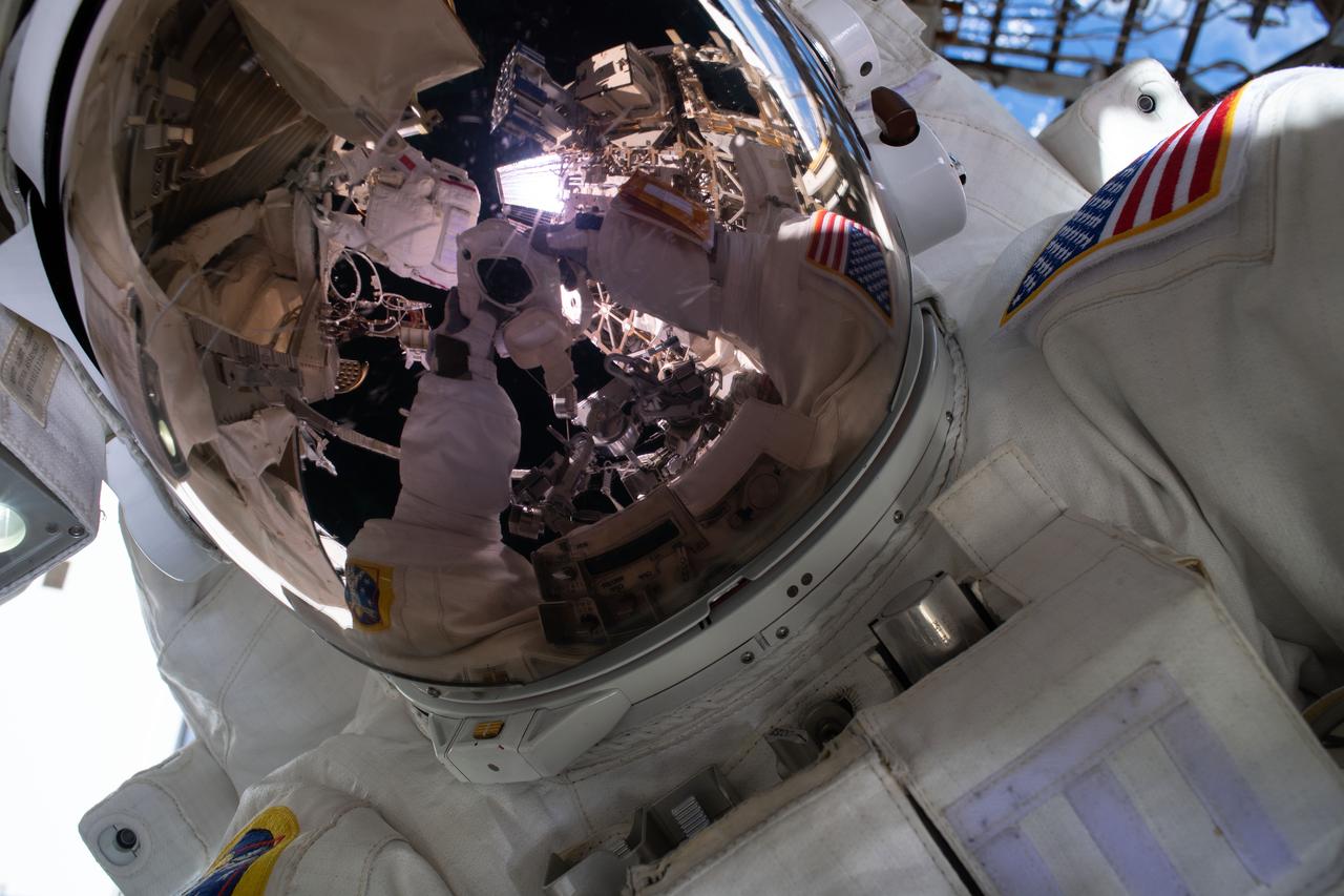 iss061e058345 (Nov. 22, 2019) --- NASA astronaut and spacewalker Andrew Morgan takes an out-of-this-world "space-selfie" with his spacesuit's helmet visor down during the second spacewalk to repair the International Space Station's cosmic particle detector, the Alpha Magnetic Spectrometer.