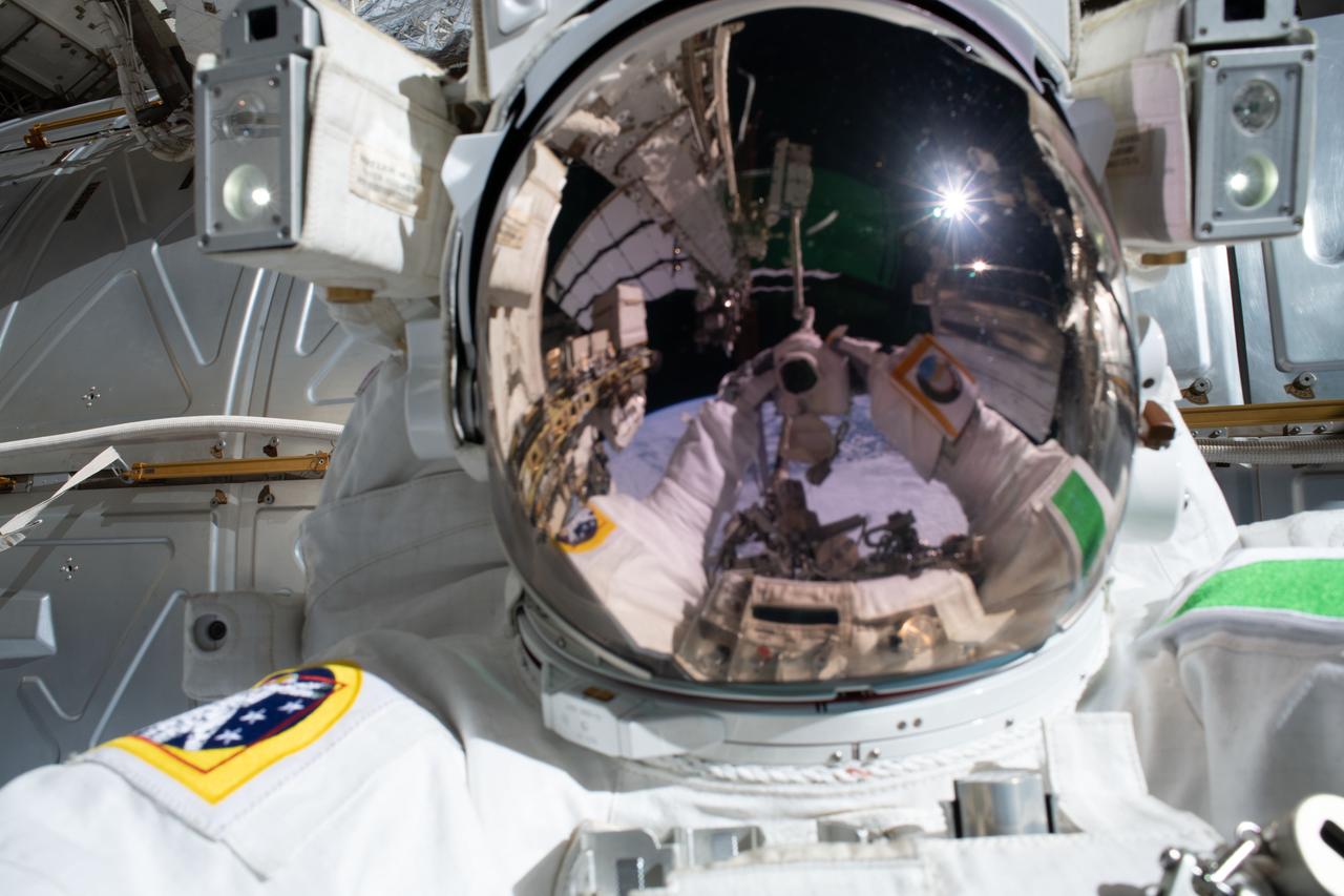 iss061e066267 (Dec. 2, 2019) --- ESA (European Space Agency) astronaut Luca Parmitano points his camera toward his U.S. helmet with the reflective visor down and takes a "space-selfie" during the third spacewalk to upgrade the Alpha Magnetic Spectrometer's thermal pump system.
