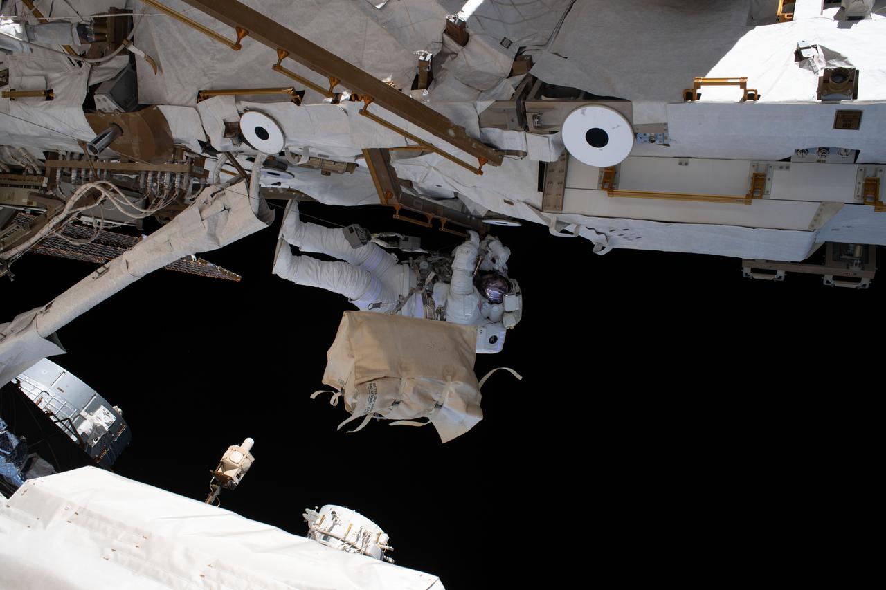 iss061e066433 (Dec. 2, 2019) --- NASA astronaut Andrew Morgan is tethered to the International Space Station during the third spacewalk to upgrade the Alpha Magnetic Spectrometer's thermal pump system.