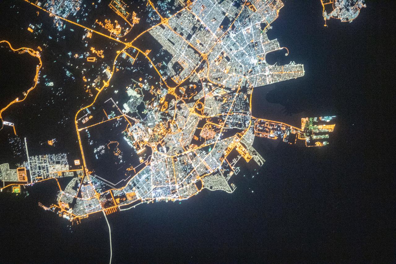 iss061e066577 (Dec. 3, 2019) --- This nighttime view of Dammam, Saudi Arabia, was pictured from the International Space Station as it orbited 262 miles above the middle eastern nation. The fork-like structure at right is the King Abdulaziz Seaport.