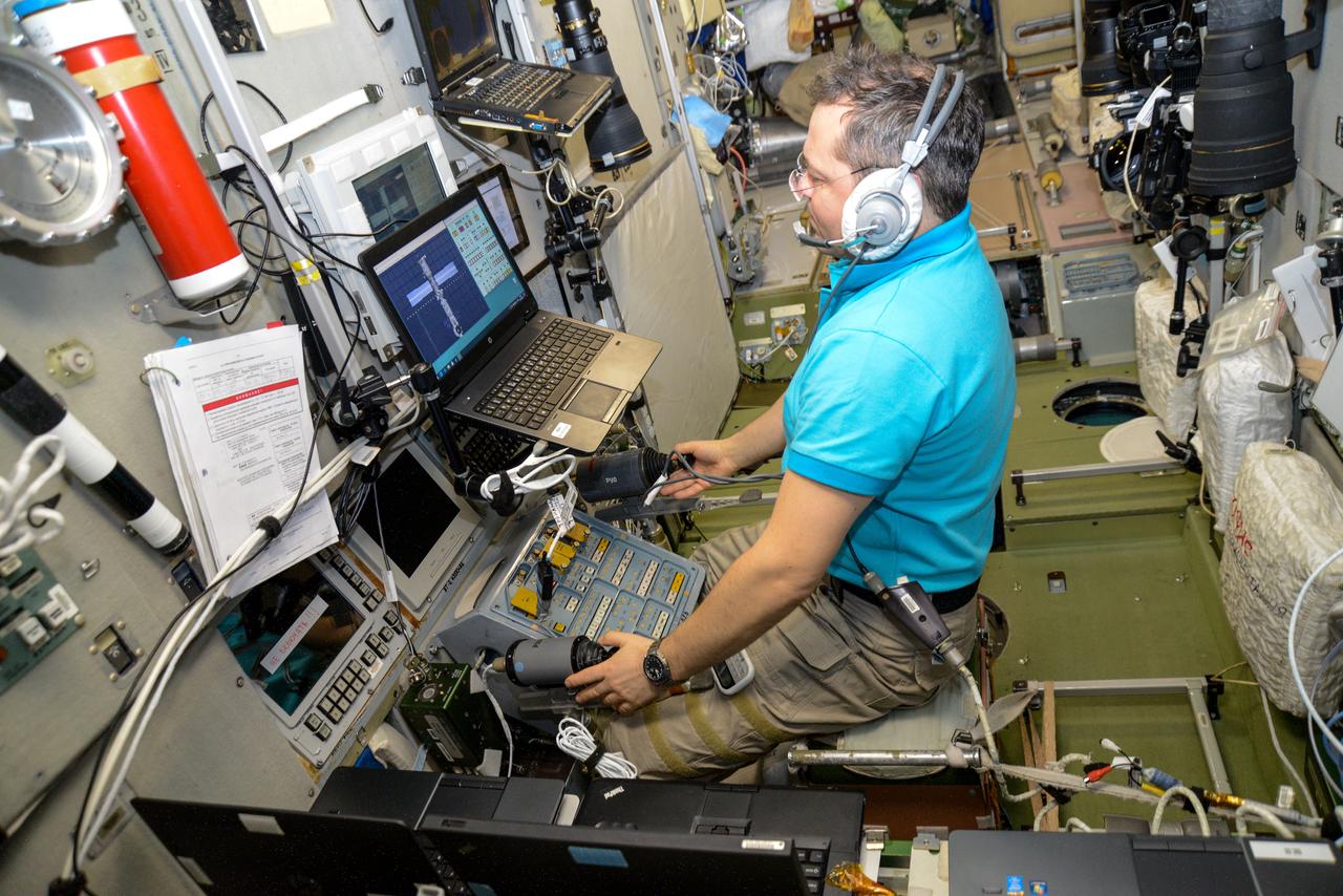 iss061e066694 (Dec. 3, 2019) --- Roscosmos cosmonaut Oleg Skripochka trains on a computer inside the Zvezda service module for the unlikely scenario he would need to telerobotically maneuver a Russian cargo craft to a docking port on the International Space Station.