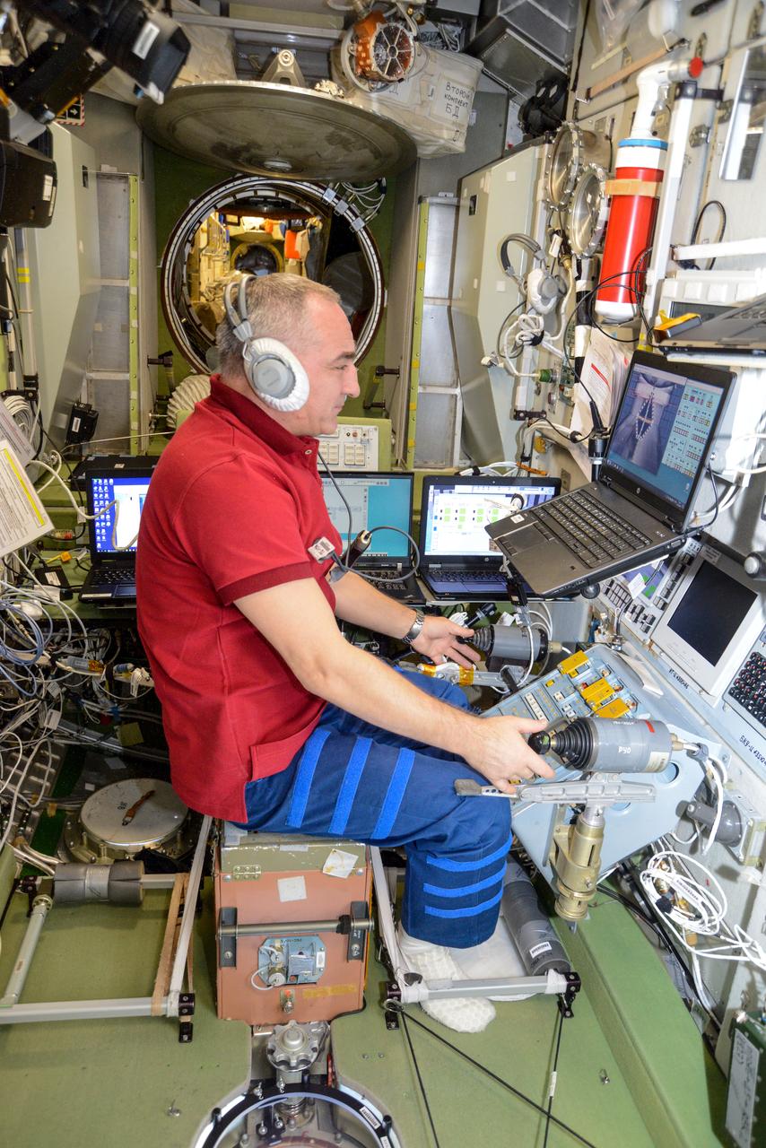 iss061e066699 (Dec. 3, 2019) --- Roscosmos cosmonaut Alexander Skvortsov trains on a computer inside the Zvezda service module for the unlikely scenario he would need to telerobotically maneuver a Russian cargo craft to a docking port on the International Space Station.
