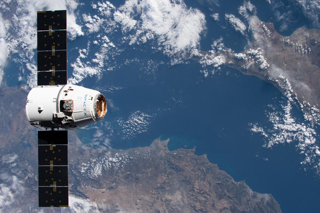 iss061e069087 (Dec. 8, 2019) --- The SpaceX Dragon resupply ship approaches the International Space Station as both spacecraft were orbiting 258 miles above the Mediterranean Sea in between Turkey and Cyprus.