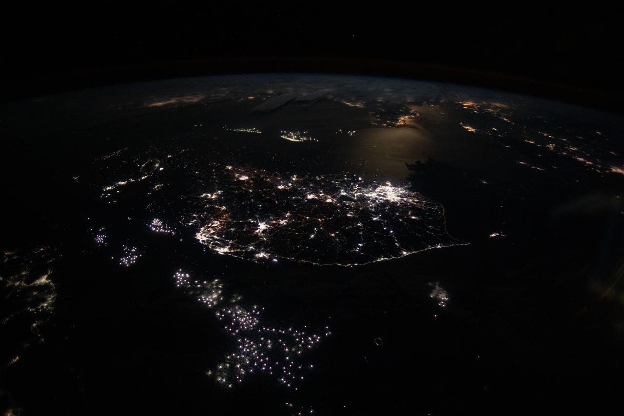 iss061e120106 (Jan. 4, 2020) --- The lights of South Korean cities and fishing boats on the Sea of Japan and the Yellow Sea are pictured as the International Space Station orbited 260 miles in altitude off the coast of Japan near Hiroshima. The brightest city lights toward the center represent the South Korean capital city of Seoul.