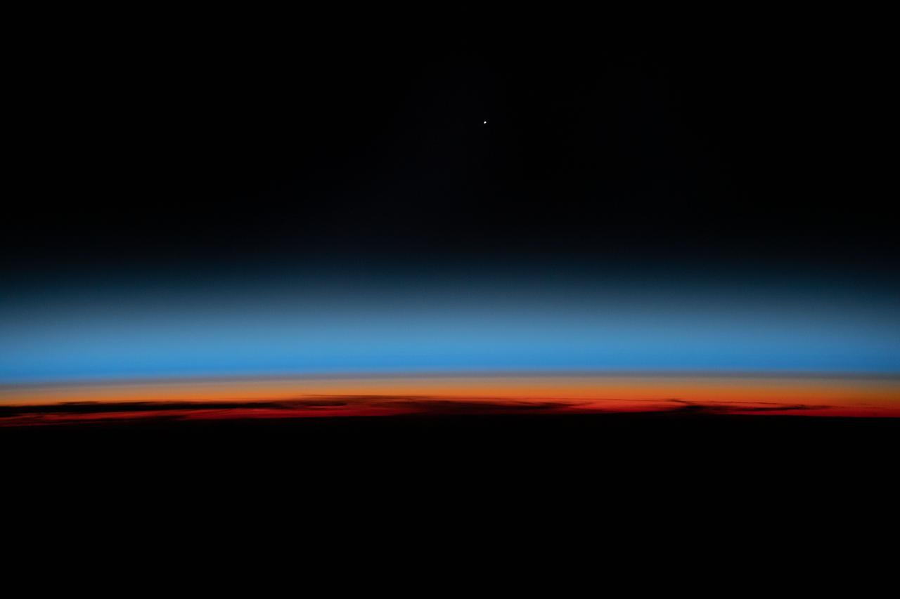 iss061e123466 (Jan. 12, 2020) --- The first rays of an orbital sunrise shine illuminates the Earth's limb and highlights the atmosphere as the International Space Station orbits 259 miles above the central United States.