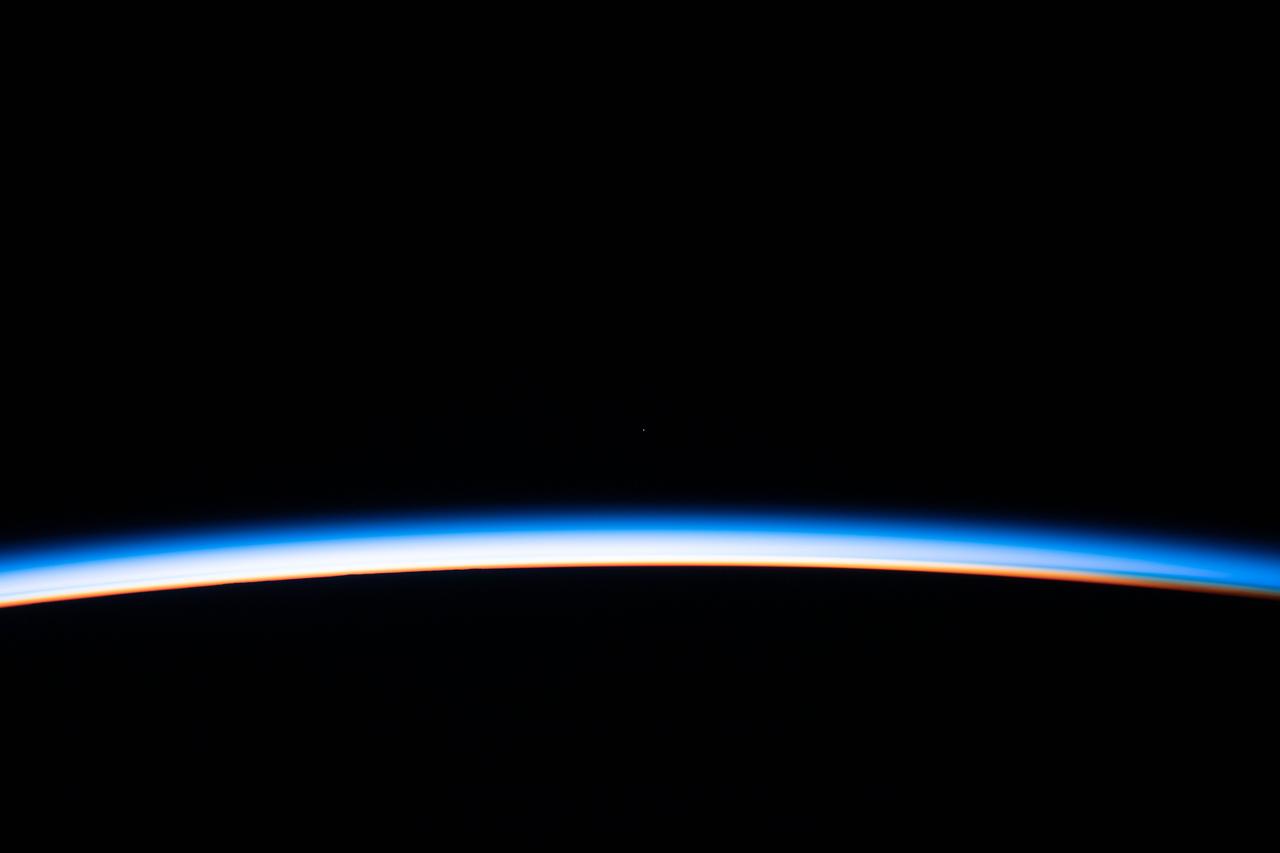 iss061e123823 (Jan. 12, 2020) --- The first rays of an orbital sunrise illuminates the Earth's limb and highlights the atmosphere as the International Space Station orbits 260 miles above the Atlantic Ocean.