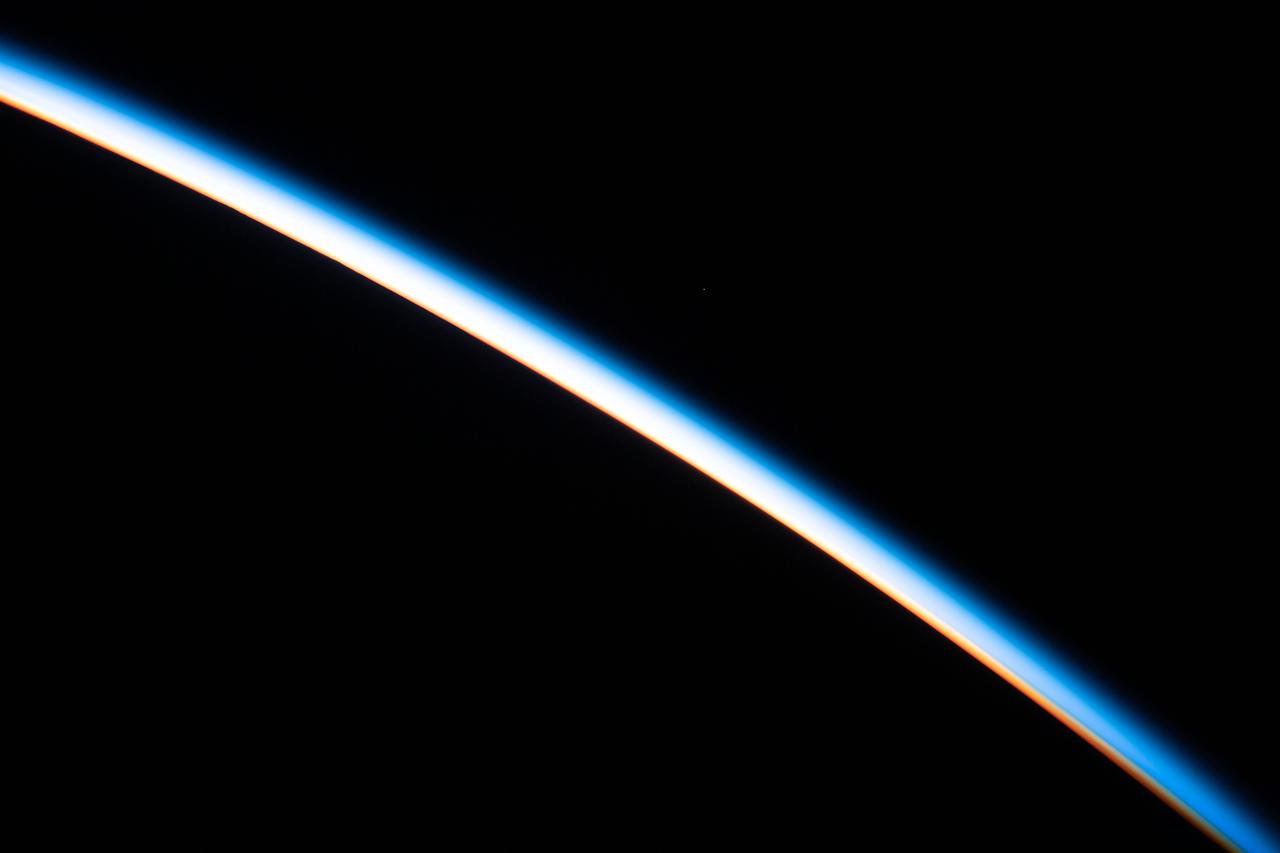 iss061e123824 (Jan. 12, 2020) --- The first rays of an orbital sunrise illuminates the Earth's limb and highlights the atmosphere as the International Space Station orbits 260 miles above the Atlantic Ocean.