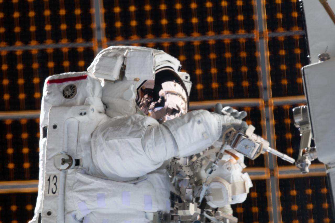 iss061e126136 (Jan. 15, 2020) --- NASA astronaut Jessica Meir is pictured during a spacewalk she conducted with NASA astronaut Christina Koch Jessica Meir (out of frame) to install new lithium-ion batteries that store and distribute power collected from solar arrays on the station’s Port-6 truss structure.