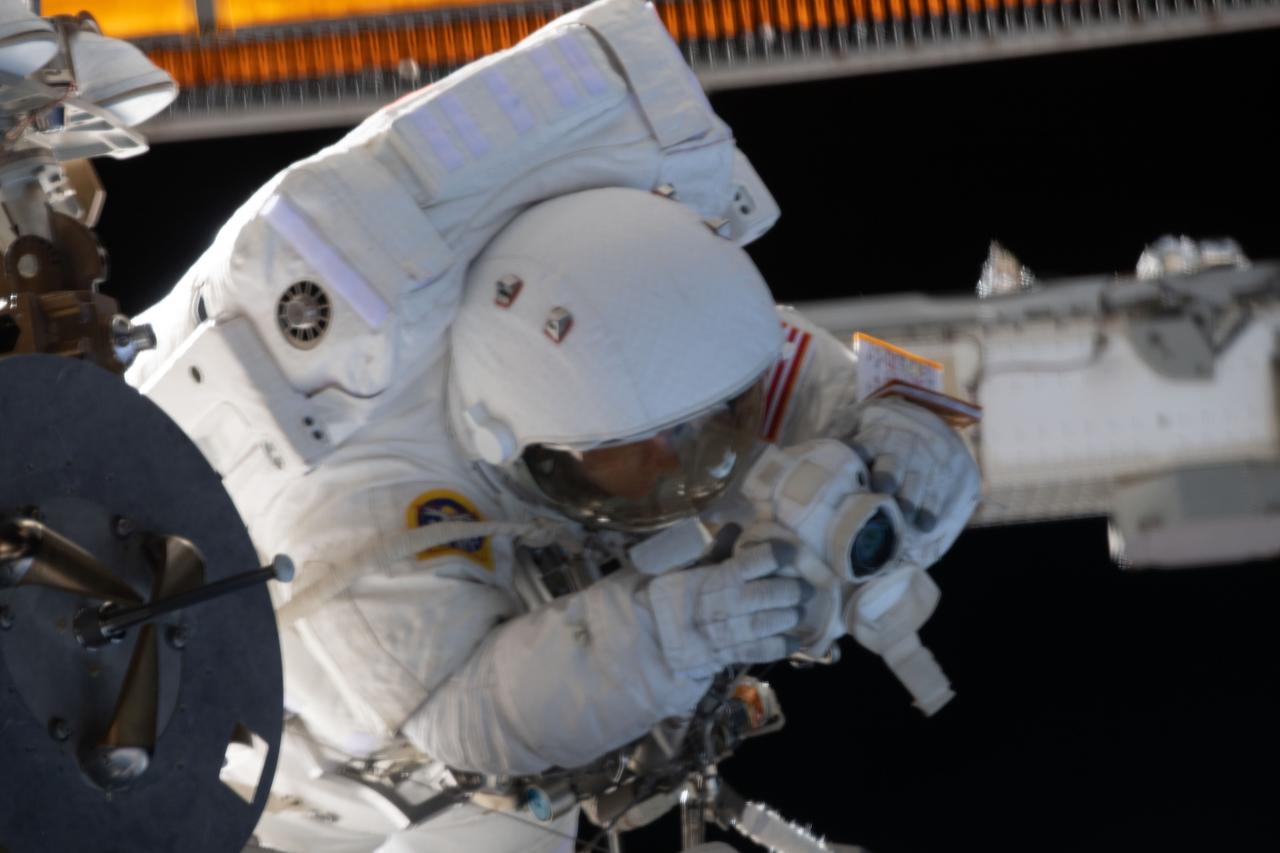 iss061e126154 (Jan. 15, 2020) --- NASA astronaut Christina Koch is pictured during a spacewalk she conducted with NASA astronaut Jessica Meir (out of frame) to install new lithium-ion batteries that store and distribute power collected from solar arrays on the station’s Port-6 truss structure.