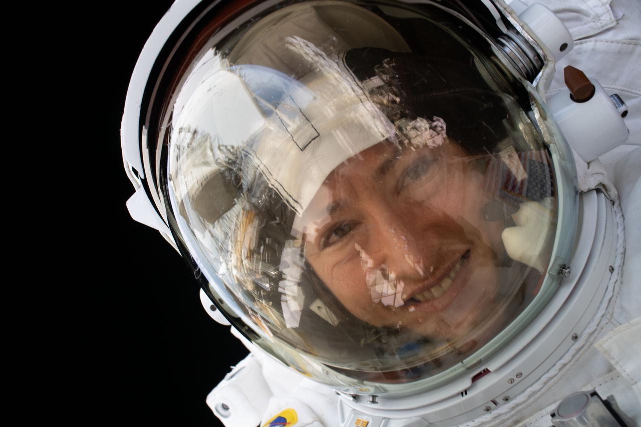 iss061e126557 (Jan. 15, 2020) --- NASA astronaut Christina Koch is pictured during a spacewalk she conducted with NASA astronaut Jessica Meir (out of frame) to install new lithium-ion batteries that store and distribute power collected from solar arrays on the station’s Port-6 truss structure.