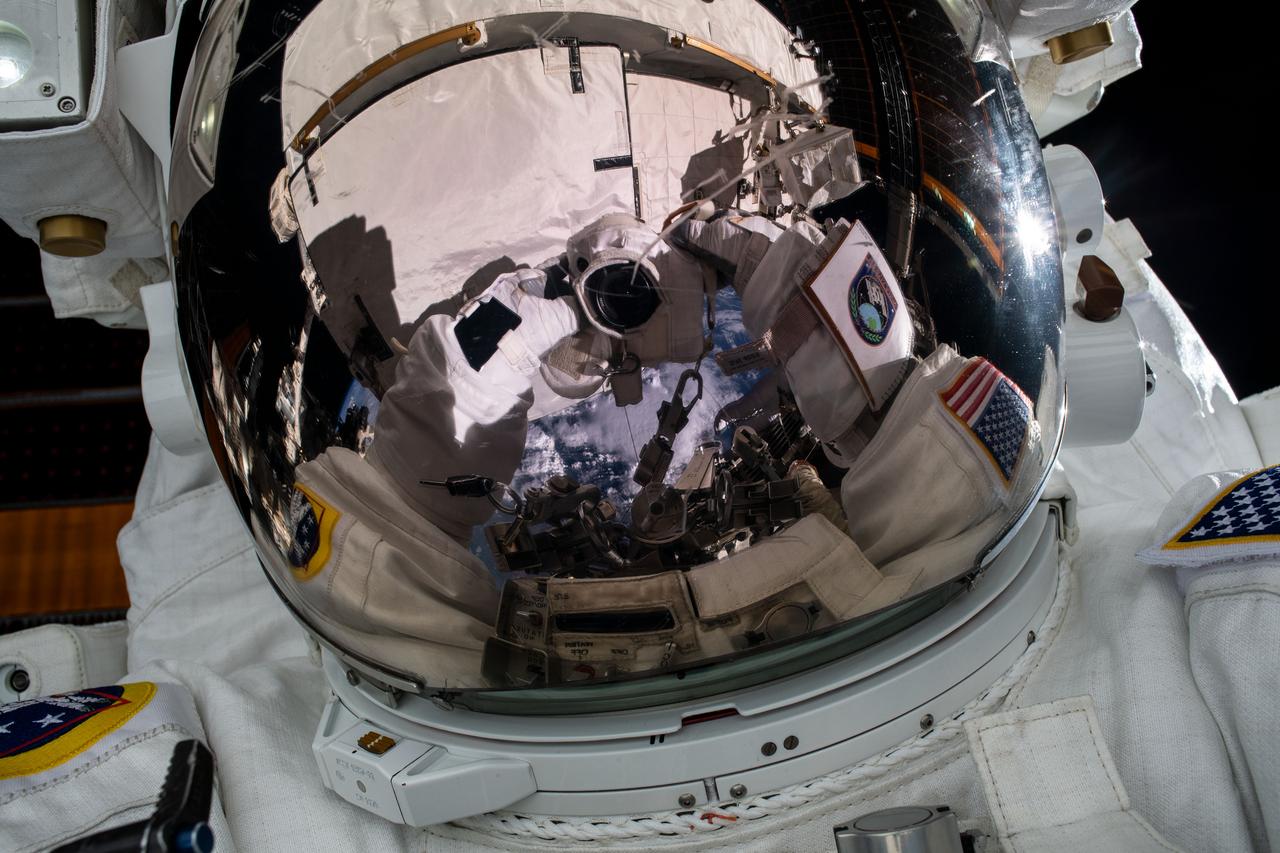 iss061e126557 (Jan. 15, 2020) --- NASA astronaut Jessica Meir takes an out-of-this-world "space-selfie" during a spacewalk she conducted with NASA astronaut Christina Koch (out of frame) to install new lithium-ion batteries that store and distribute power collected from solar arrays on the station’s Port-6 truss structure.