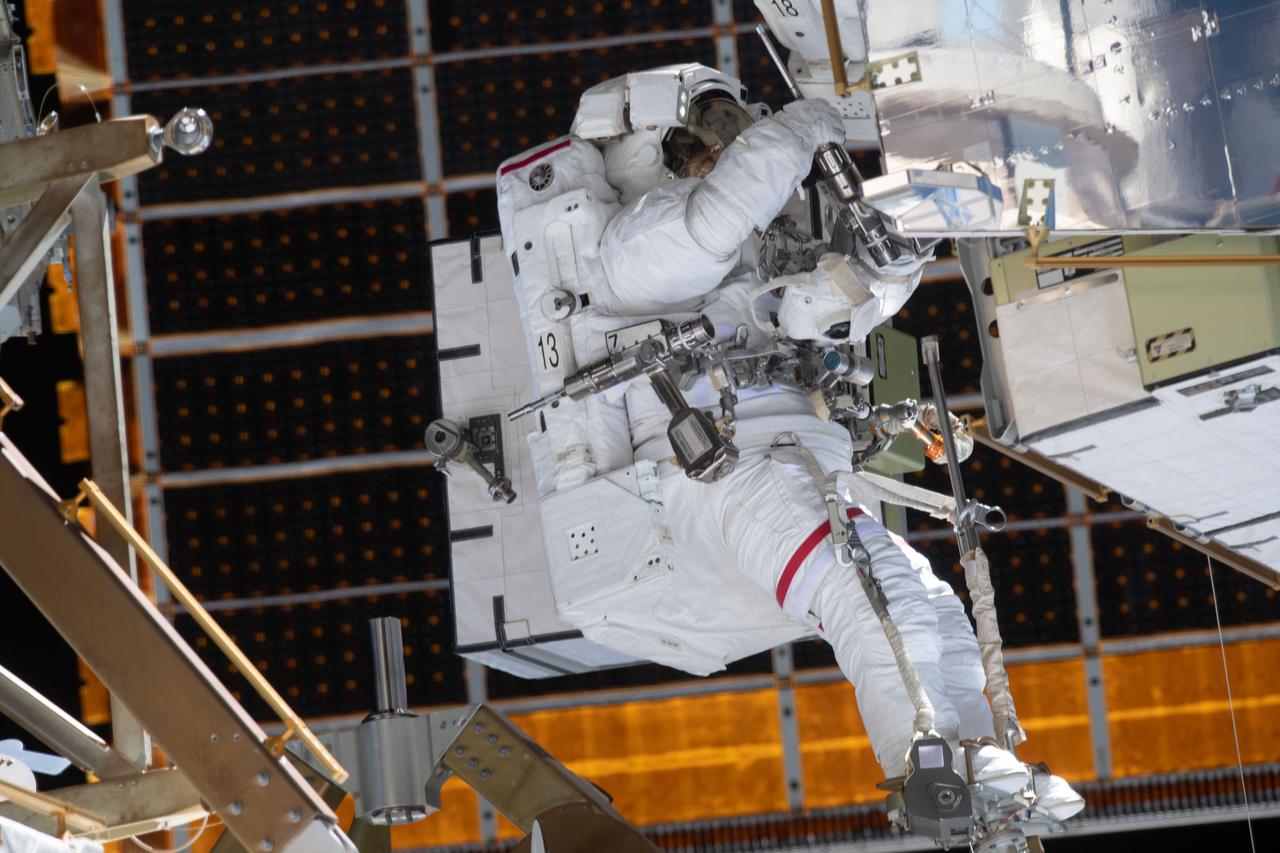 iss061e136274 (Jan. 20, 2020) --- NASA astronaut Jessica Meir is outfitted with pistol grip tools and attached to an articulating portable foot restraint during a spacewalk to finalize upgrading power systems on the International Space Station's Port-6 truss structure.
