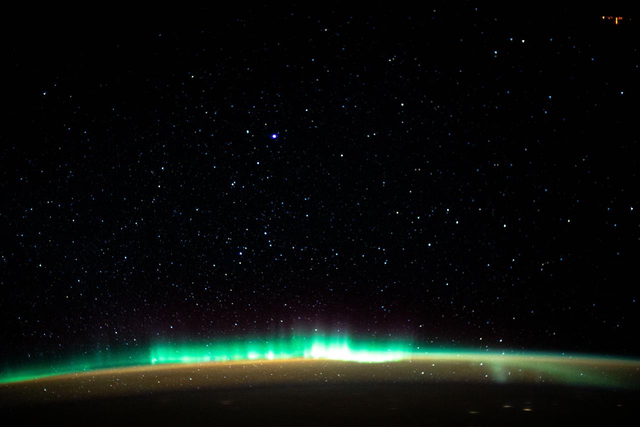 iss061e138167 (Jan. 22, 2020) --- An aurora blankets the Earth beneath a celestial night sky as the International Space Station orbited 261 miles above the Atlantic Ocean off the coast of North America.