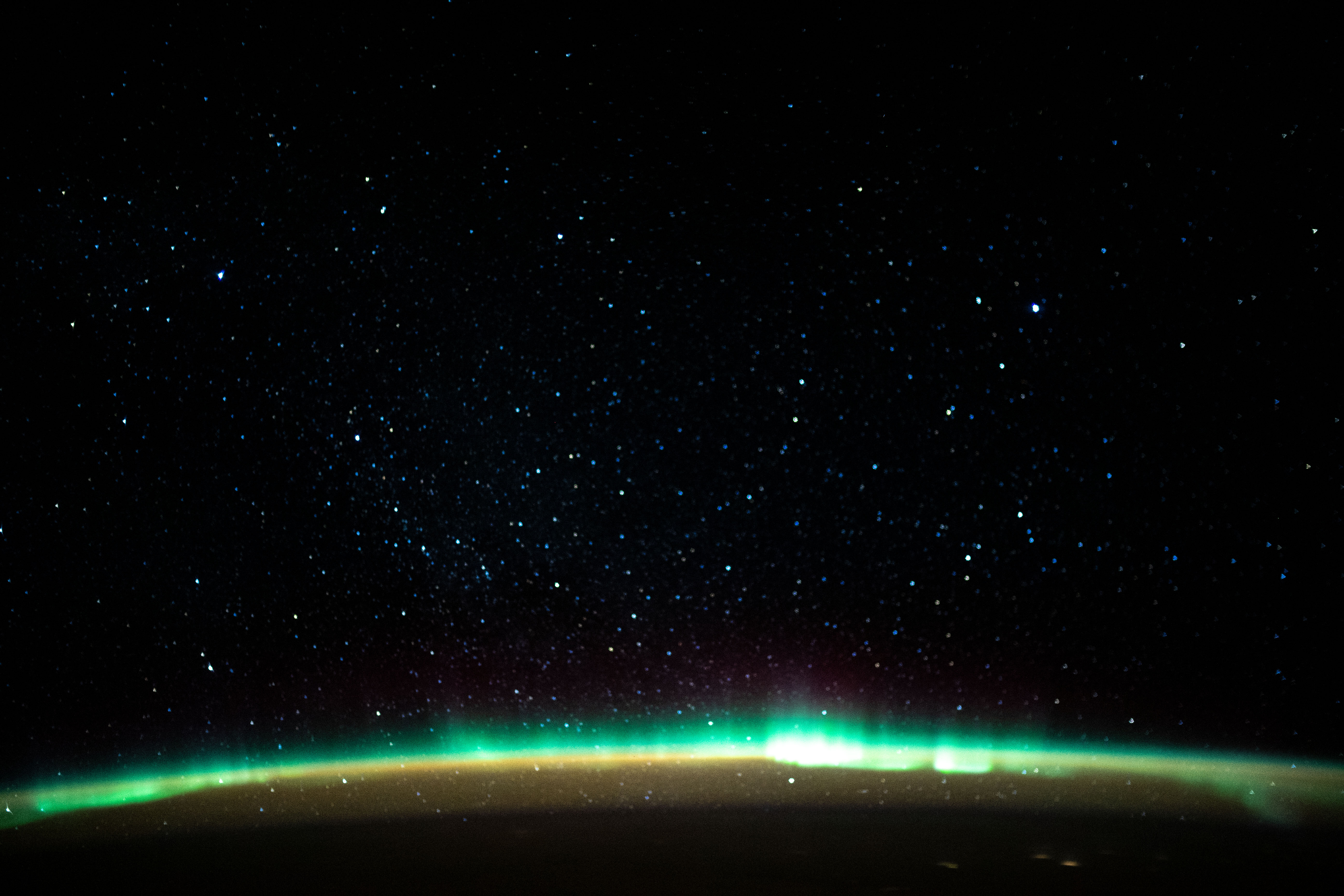 iss061e138170 (Jan. 22, 2020) --- An aurora blankets the Earth beneath a celestial night sky as the International Space Station orbited 261 miles above the Atlantic Ocean off the coast of North America.