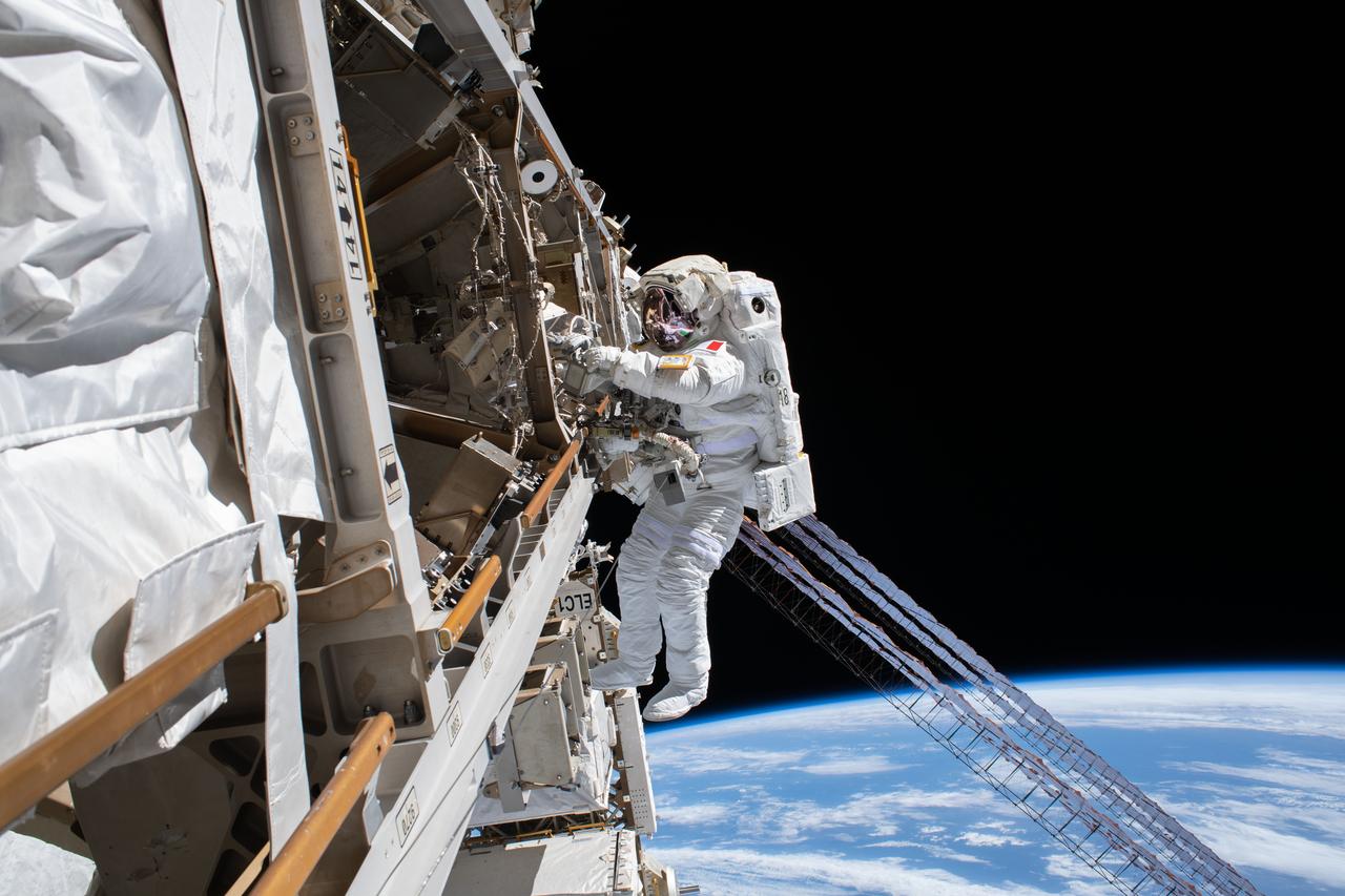 iss061e143462 (Jan. 25, 2020) --- ESA (European Space Agency) astronaut Luca Parmitano is pictured tethered to the International Space Station while finalizing thermal repairs on the Alpha Magnetic Spectrometer, a dark matter and antimatter detector, during a spacewalk that lasted 6 hours and 16 minutes.