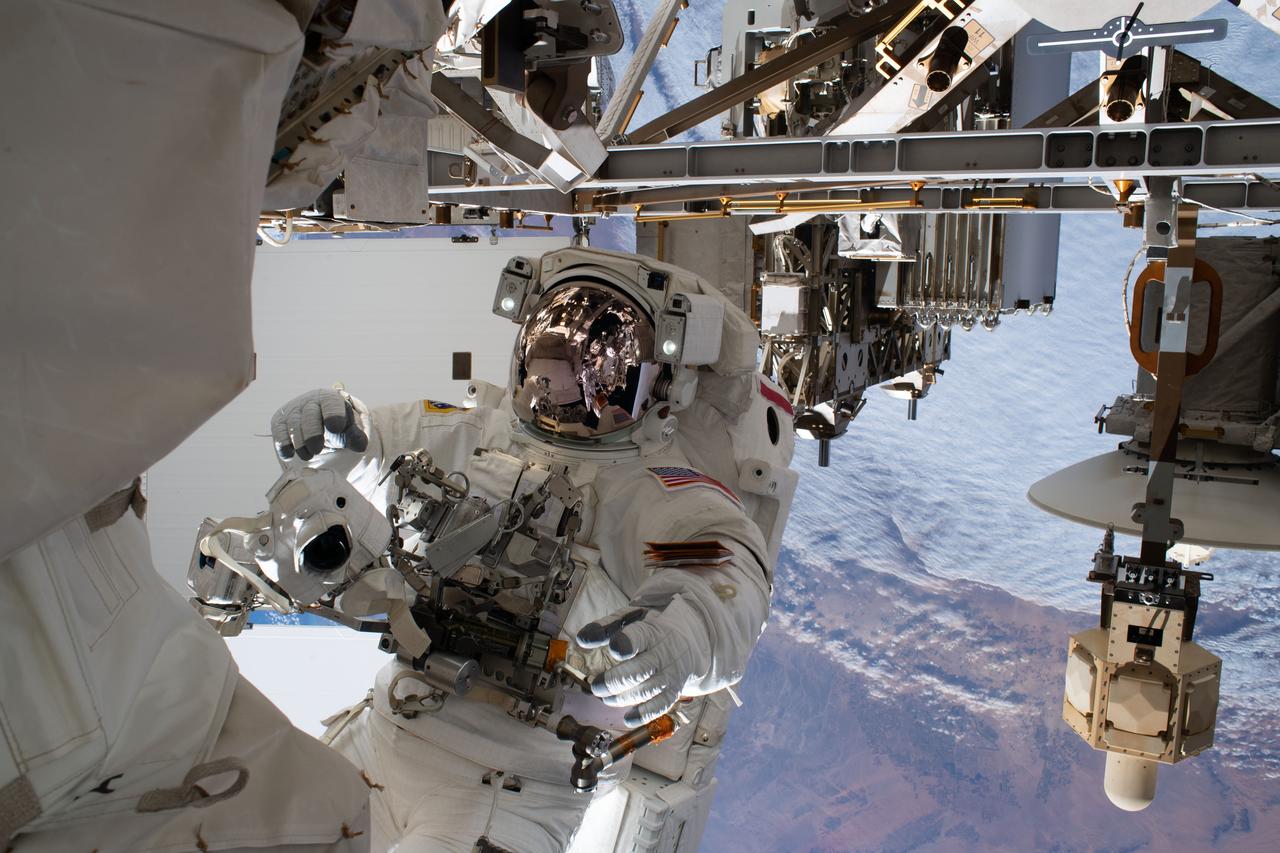 iss061e143733 (Jan. 25, 2020) --- NASA astronaut Andrew Morgan is pictured tethered to the International Space Station while finalizing thermal repairs on the Alpha Magnetic Spectrometer, a dark matter and antimatter detector, during a spacewalk that lasted 6 hours and 16 minutes.