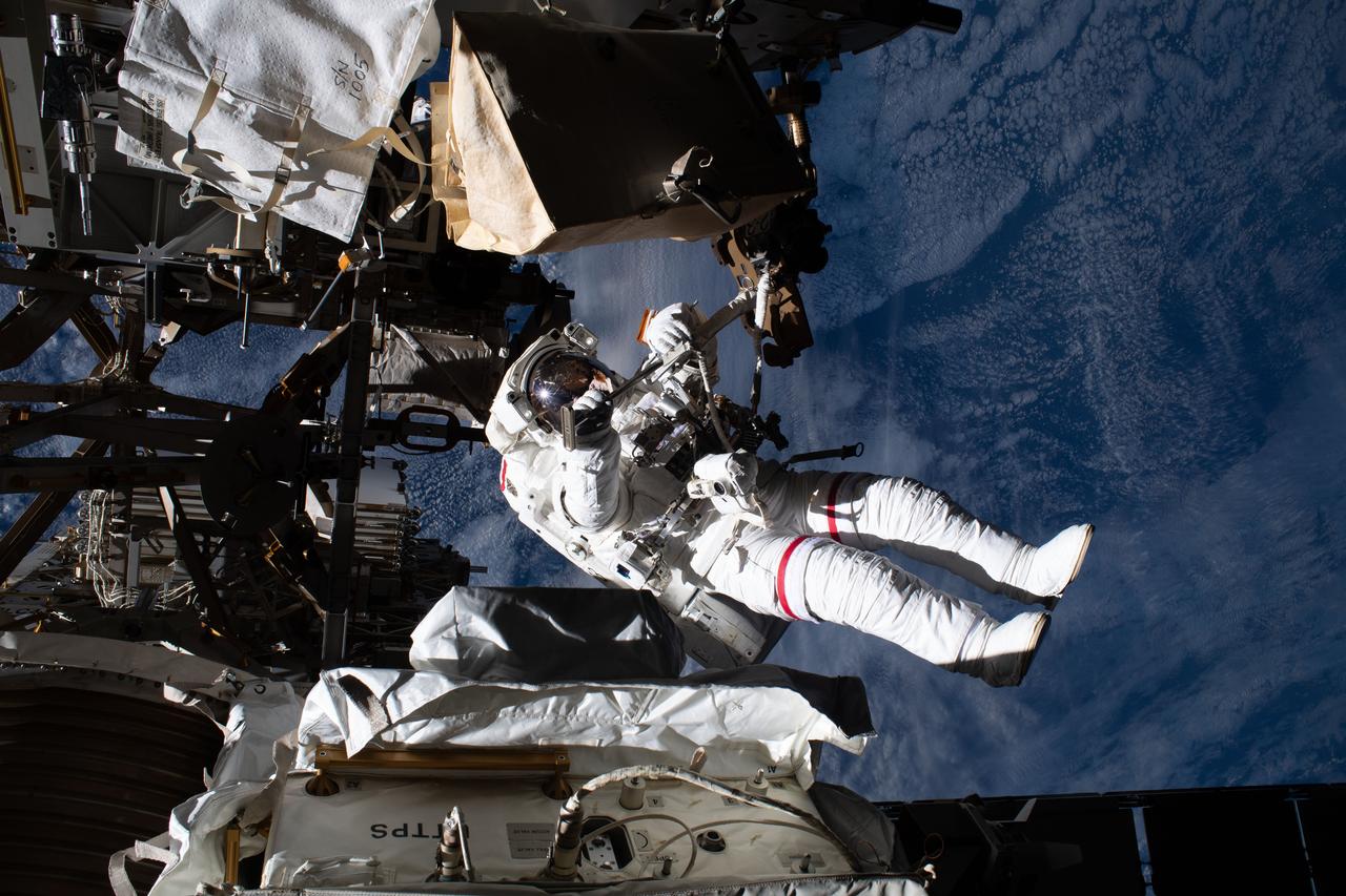 iss061e144253 (Jan. 25, 2020) --- NASA astronaut Andrew Morgan is pictured tethered to the International Space Station while finalizing thermal repairs on the Alpha Magnetic Spectrometer, a dark matter and antimatter detector, during a spacewalk that lasted 6 hours and 16 minutes.