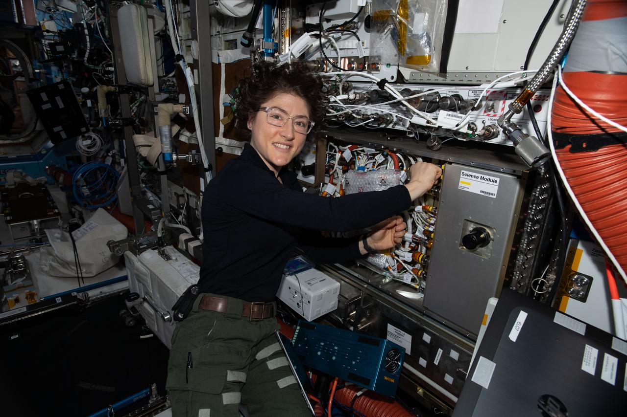 iss061e145487 (Jan. 28, 2020) --- NASA astronaut and Expedition 61 Flight Engineer Jessica Koch works on the Cold Atom Lab (CAL) swapping and cleaning hardware inside the quantum research device. The CAL enables research into the quantum effects of gases chilled to nearly absolute zero, which is colder than the average temperature of the universe.