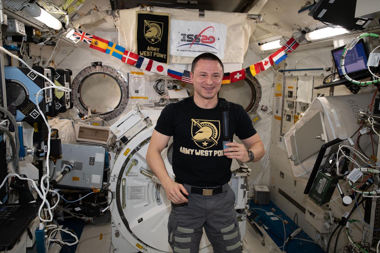 iss062e112559 (March 24, 2020) --- NASA astronaut and Expedition 62 Flight Engineer Andrew Morgan, a graduate of the U.S. Military Academy in West Point, New York, and the Uniformed Services University of the Health Sciences in Bethesda, Maryland, is pictured inside the Kibo laboratory module talking to personnel on the ground.