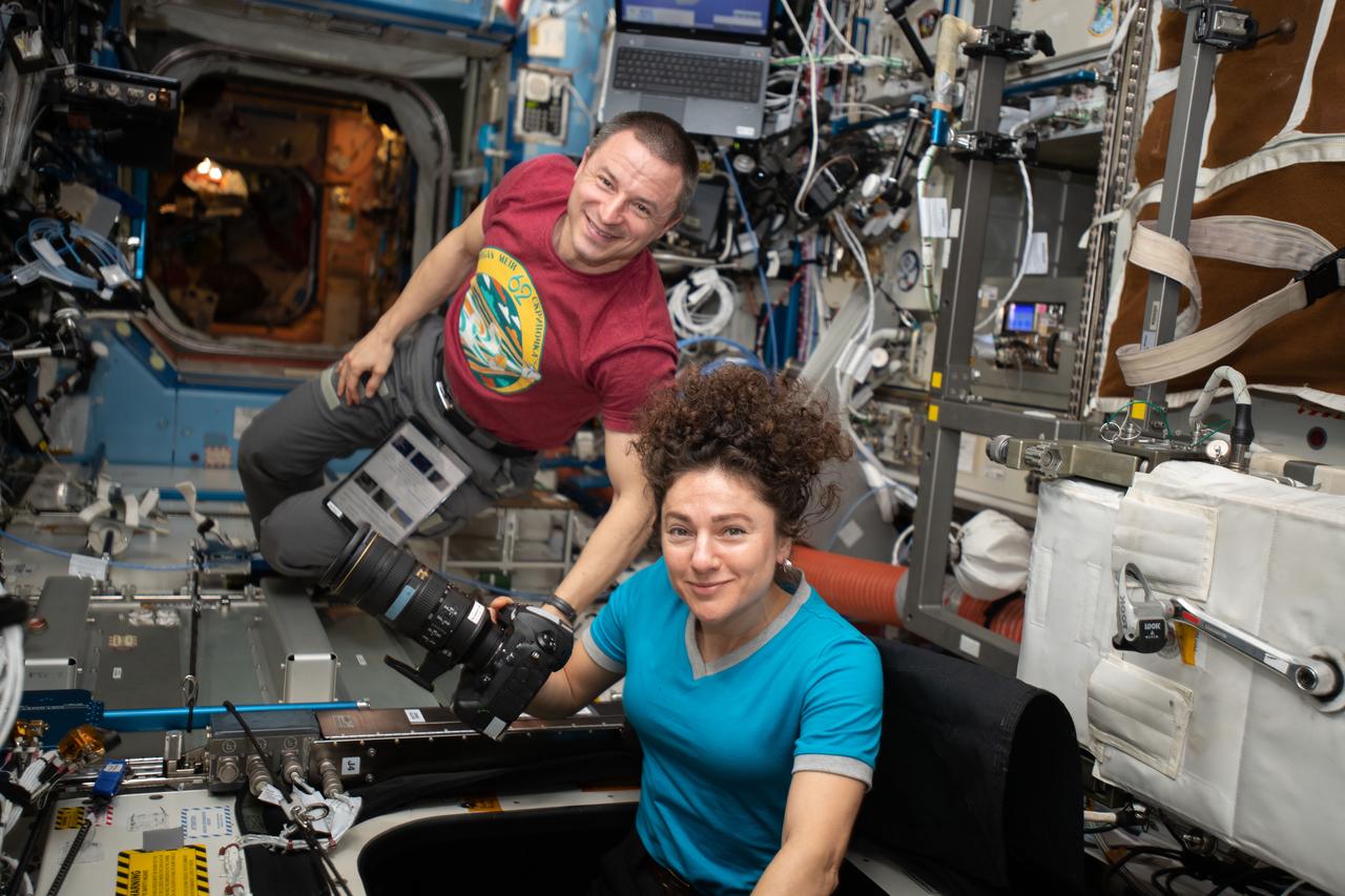 iss062e141186 (March 10, 2020) ---NASA astronauts and Expedition 62 Flight Engineers Andrew Morgan and Jessica Meir participate in Earth photography activities inside the Destiny laboratory module's Window Observation Research Facility.