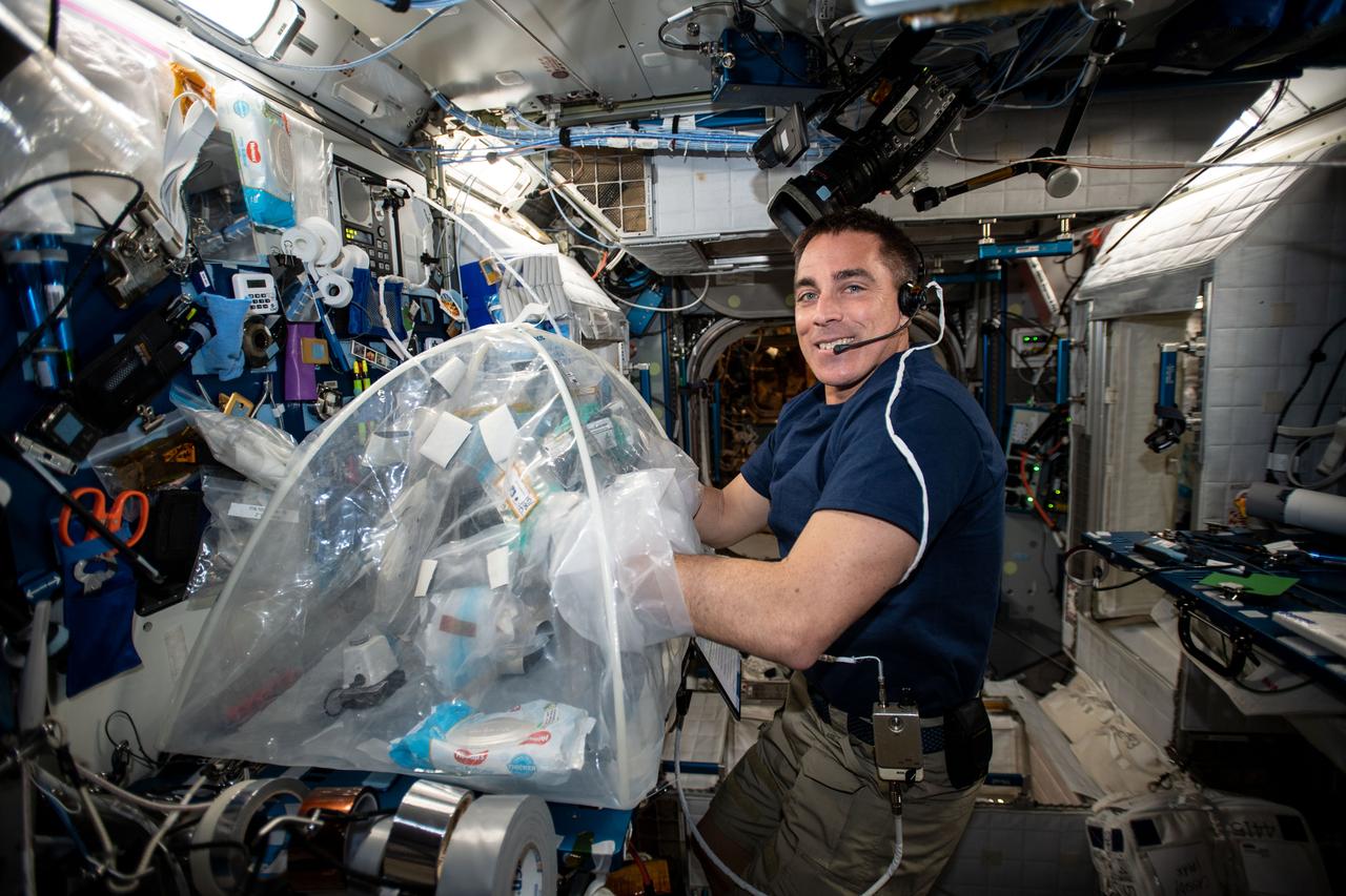 ss062e151904 (April 16, 2020) --- NASA astronaut Chris Cassidy services biological samples in a glovebag aboard the International Space Station (ISS) for the Food Physiology experiment to characterize the key effects of an enhanced spaceflight diet on immune function, the gut microbiome, and nutritional status indicators.