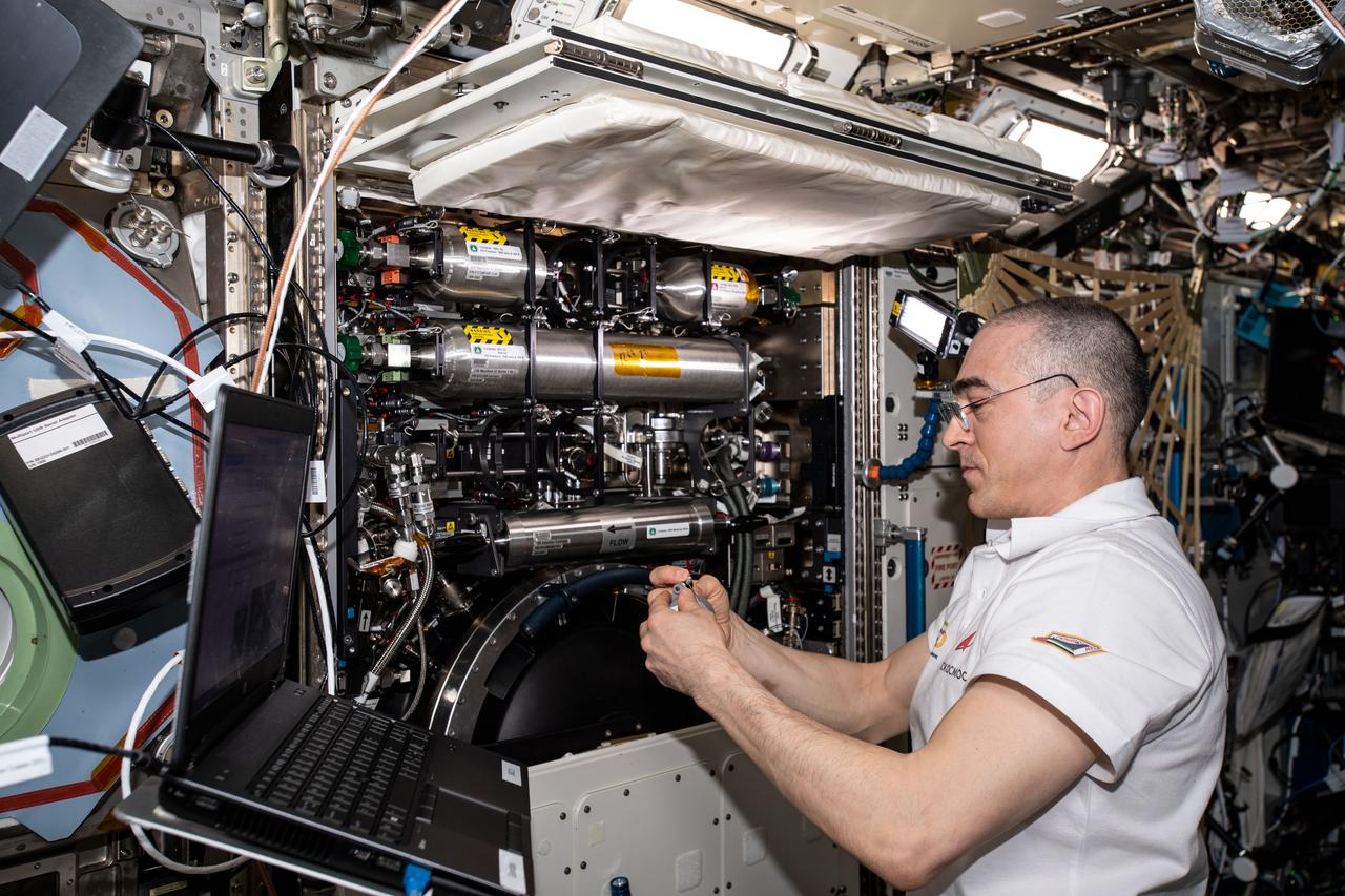 iss063e004685 (May 1, 2020) --- Roscosmos cosmonaut and Expedition 63 Flight Engineer Anatoly Ivanishin services components and replaces fuel bottles inside the Combustion Integrated Rack (CIR). The CIR is a research device that enables safe fuel, flame and soot studies in microgravity.