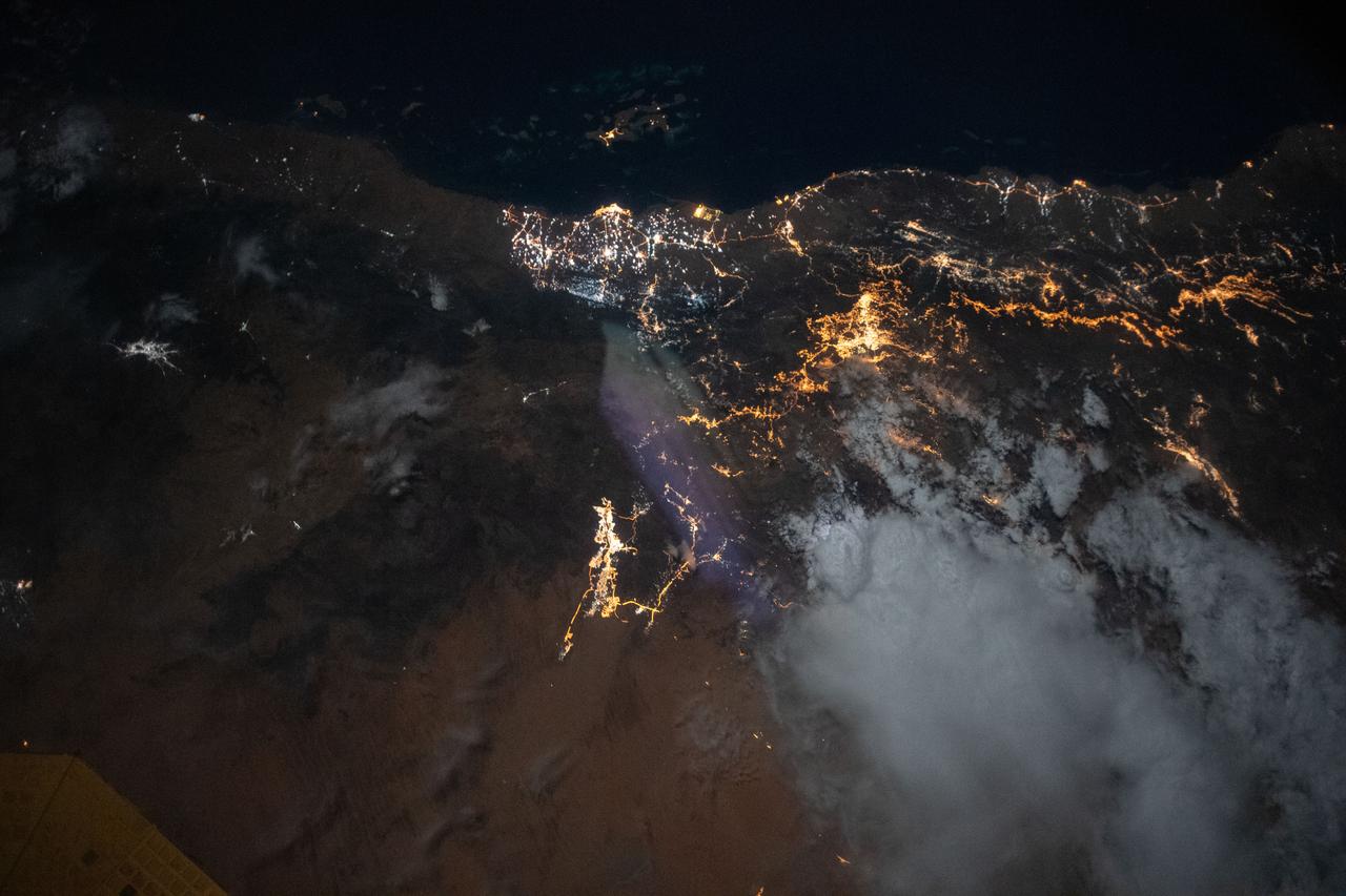 iss063e006708 (May 5, 2020) --- The city lights of Jazan (top center) and its suburbs on the Persian Gulf coast of Saudi Arabia are easily visible from the International Space Station during an orbital night pass. Just off the coast of Jazan is the Farason Island Marine Sanctuary.