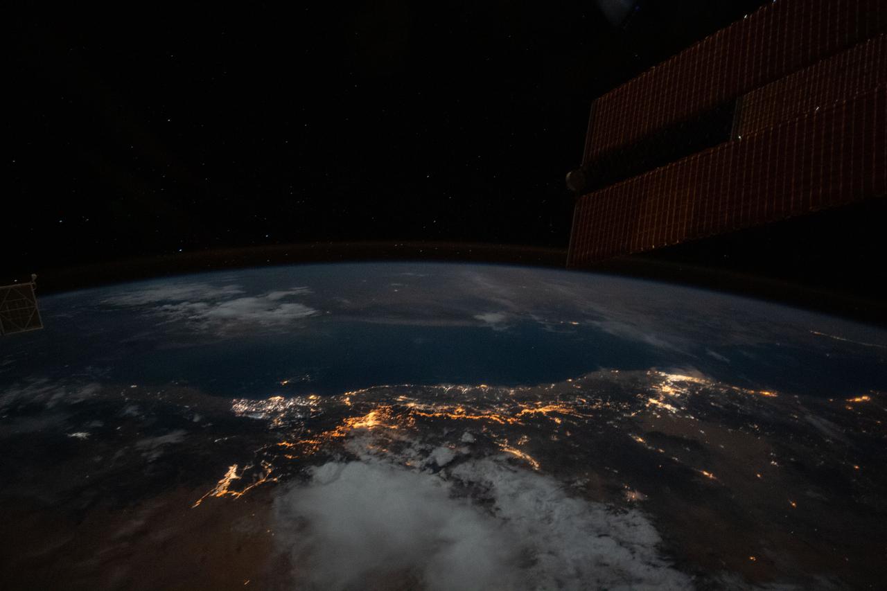 iss063e006714 (May 5, 2020) --- The well lit Persian Gulf coast of Saudi Arabia is pictured from the International Space Station during an orbital night pass.