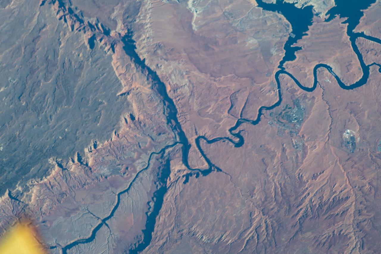 iss063e010159 (May 7, 2020) --- The Colorado River, Horseshoe Bend and a portion of Lake Powell, located in Arizona, is pictured from the International Space Station as it orbited above the southwestern United States.