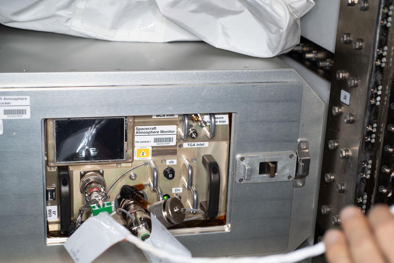 iss063e012706 (5/14/2020) --- A view of the Spacecraft Atmosphere Monitor inside Spacecraft Atmosphere Monitor Locker in the U.S. Laboratory Expedite the Processing of Experiments to the Space Station (EXPRESS) Rack 8 aboard the International space Station (ISS). The Spacecraft Atmosphere Monitor investigation demonstrates the capabilities of a small, reliable, portable gas chromatograph mass spectrometer instrument aboard the ISS to conduct major and minor elements of air measurement. The instrument transmits data back to the ground research team every two seconds, providing a continuous analysis to the ground research team.