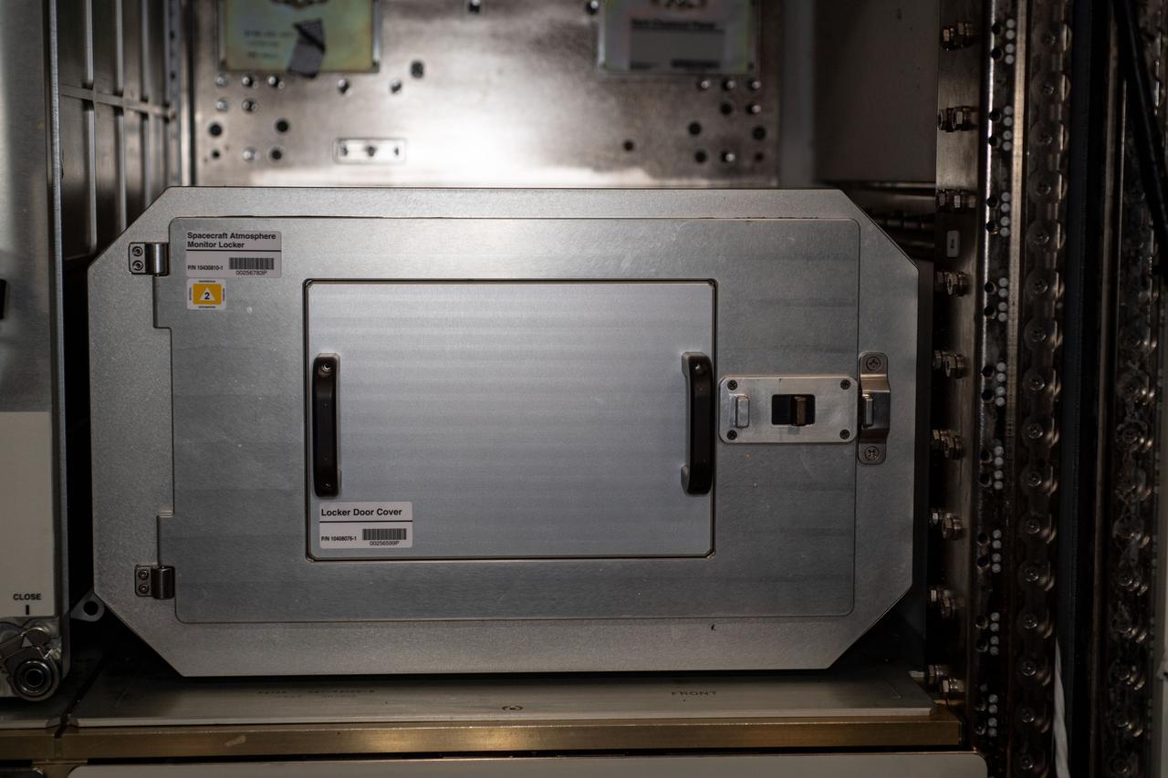 iss063e012814 (5/14/2020) --- A view of Spacecraft Atmosphere Monitor empty locker at Expedite the Processing of Experiments to the Space Station (EXPRESS) Rack 8 shown with protective locker door cover installed in the U.S. Laboratory aboard the International Space Station (ISS). The Spacecraft Atmosphere Monitor investigation demonstrates the capabilities of a small, reliable, portable gas chromatograph mass spectrometer instrument aboard the ISS to conduct major and minor elements of air measurement. The instrument transmits data back to the ground research team every two seconds, providing a continuous analysis to the ground research team.