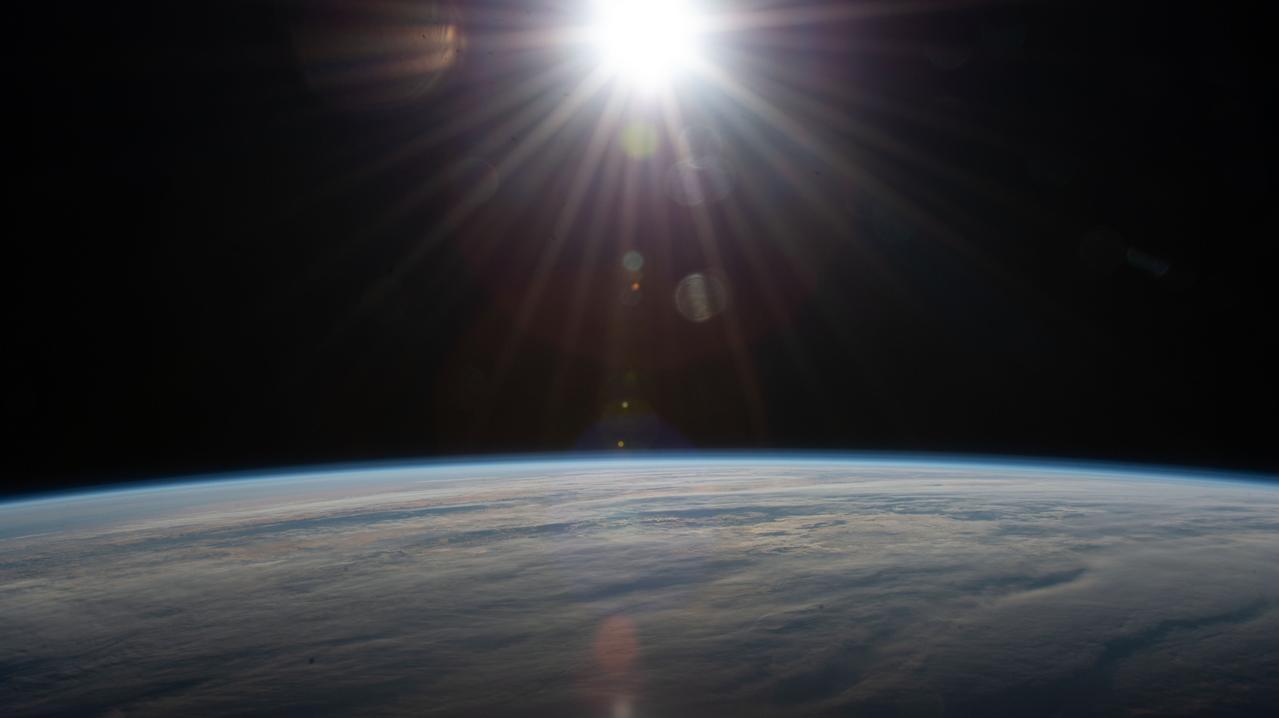 iss063e017117 (May 24, 2020) --- The sun's rays glisten in this photograph from an external high definition camera as the International Space Station orbited over the Atlantic Ocean southwest of South Africa.