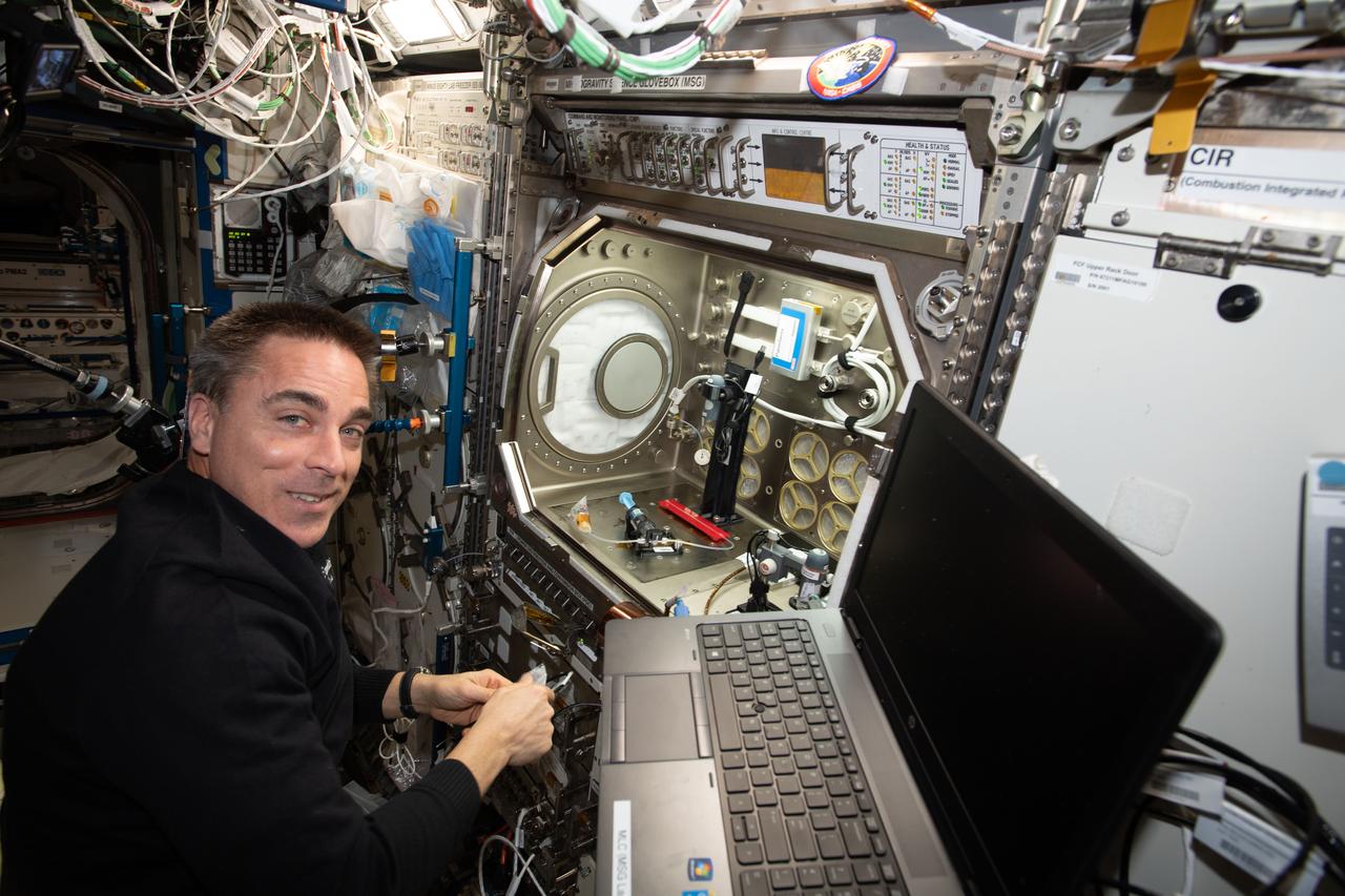 iss063e022562 (June 3, 2020) --- NASA astronaut and Expedition 63 Commander Chris Cassidy sets up the Microgravity Science Glovebox for a space bubbles experiment. The Electrolysis Measurement study is observing how bubbles inside microfluid systems may help produce oxygen on a spacecraft and deliver drugs though skin patches.