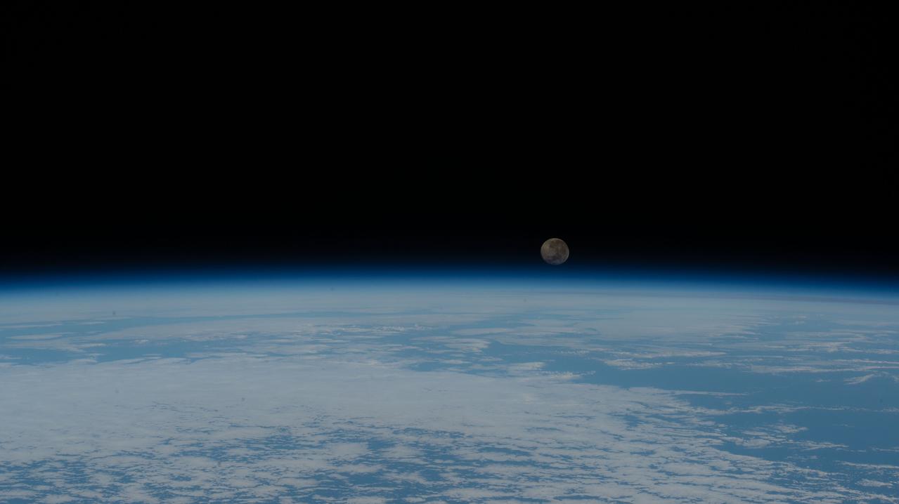 iss063e025498 (June 7, 2020) --- A waning gibbous Moon is pictured just above the Earth's horizon as the International Space Station orbited over the Atlantic Ocean just off the coast of the African nation of Angola.