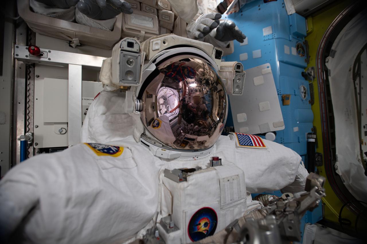 iss063e030841 (June 21, 2020) --- A U.S. spacesuit is pictured in the Quest airlock of the International Space Station ahead of spacewalks that astronauts Chris Cassidy and Behnken will conduct to upgrade orbital lab power systems.